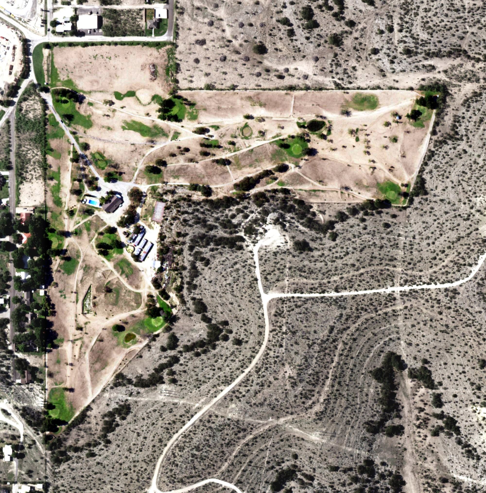 Aerial view of Ozone Country Club, TX, with its hole routing marked