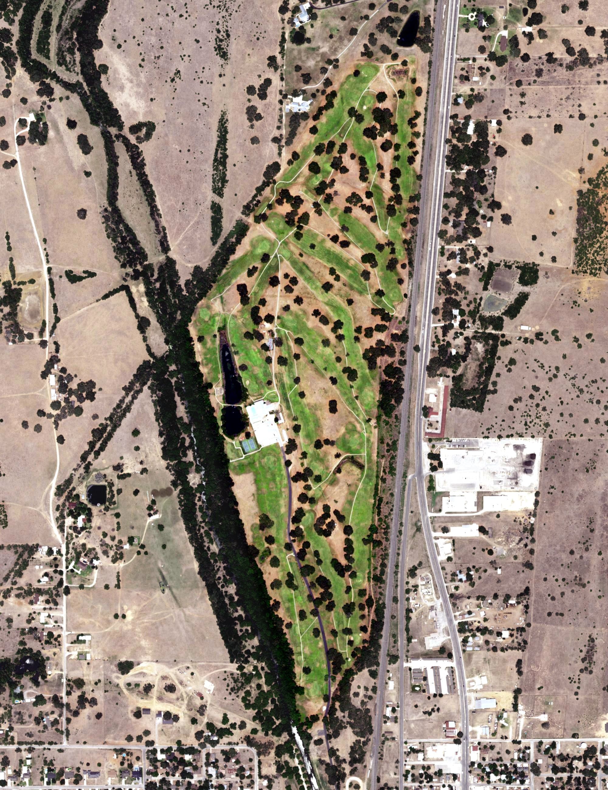 Aerial view of Pleasanton Country Club, TX, with its hole routing marked