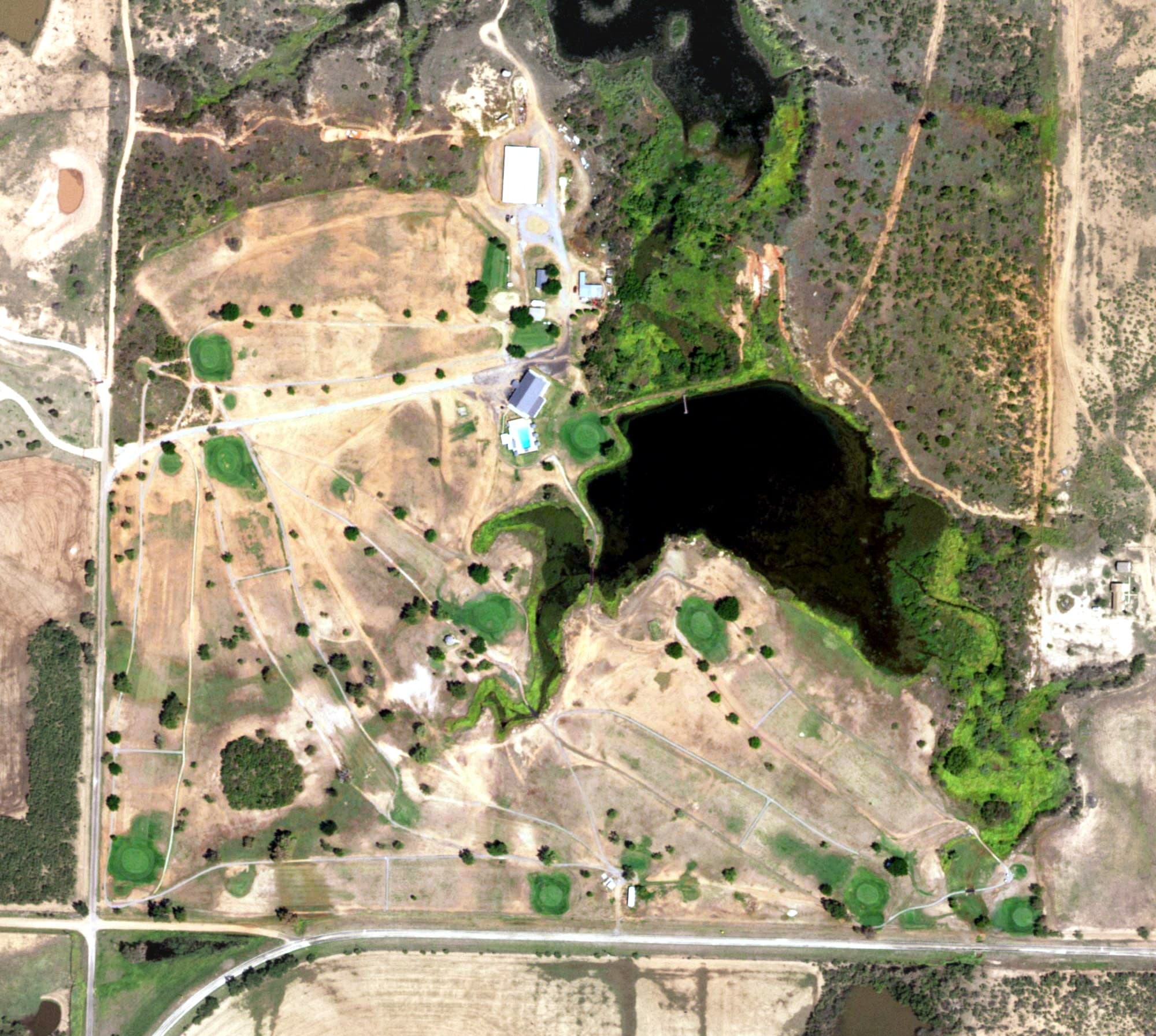 Aerial view of Quanah Country Club, TX, with its hole routing marked