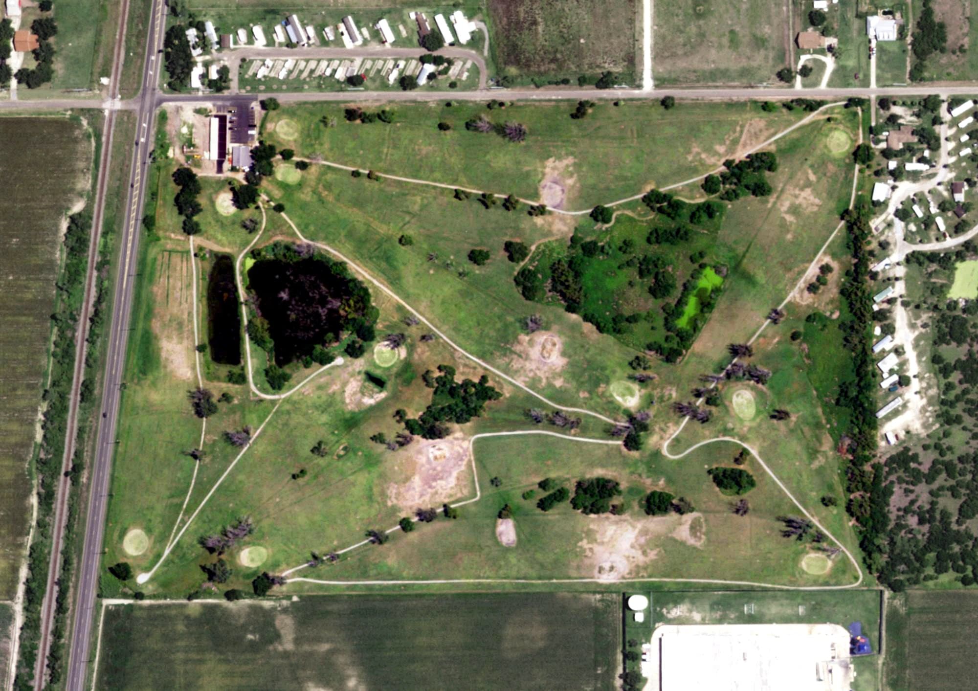 Aerial view of Raymondville Golf Course, TX, with its hole routing marked