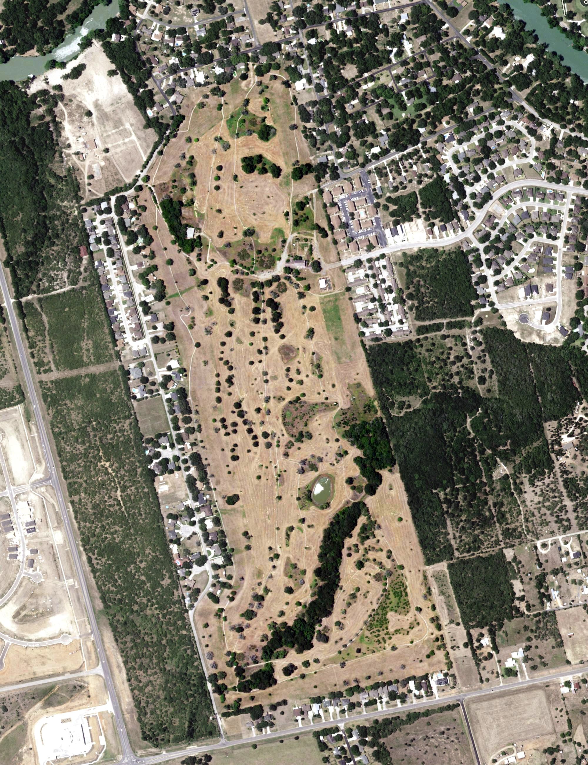 Aerial view of The Golf Club of Seguin, TX, with its hole routing marked