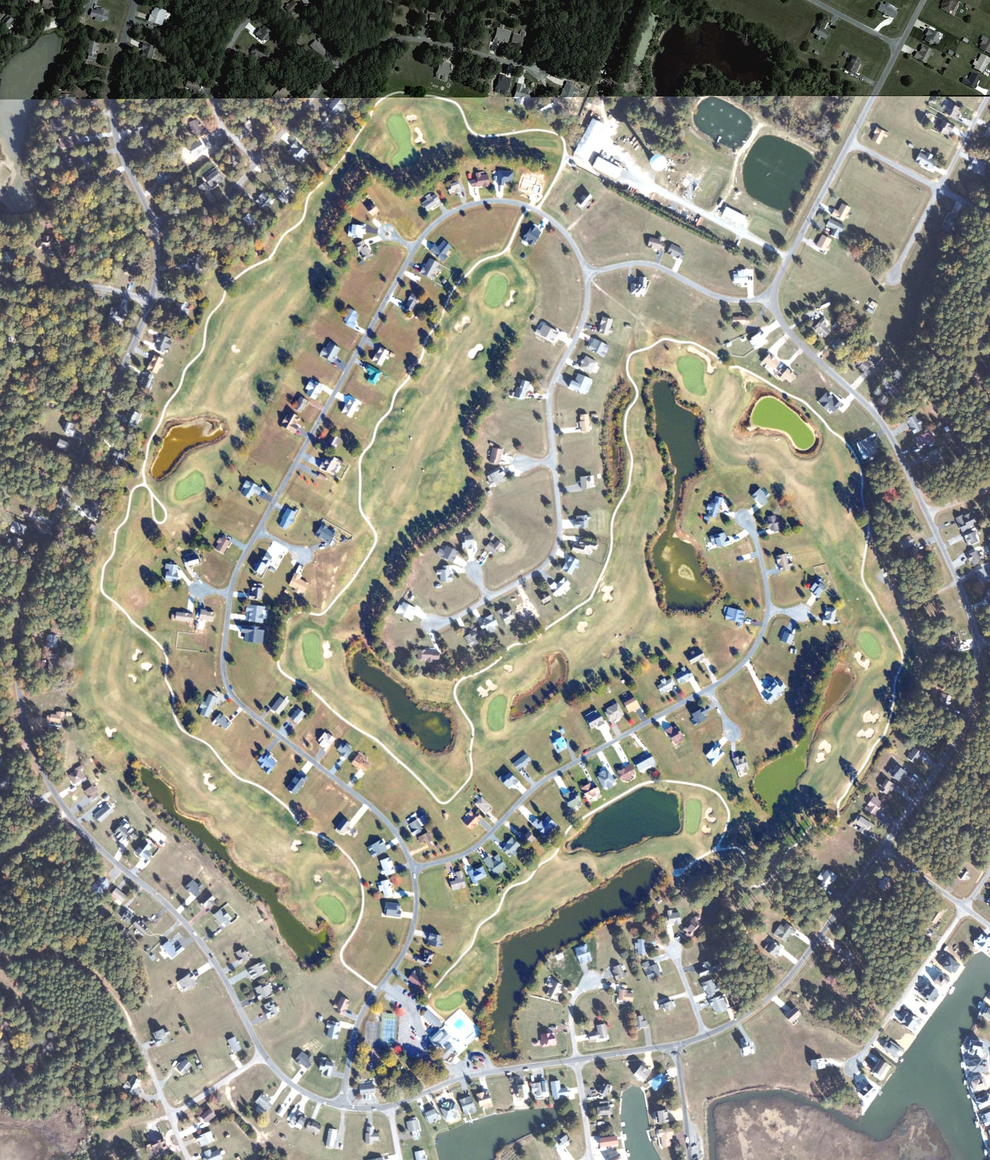 Aerial view of Captain's Cove Golf and Yacht Club, VA, with its hole routing marked
