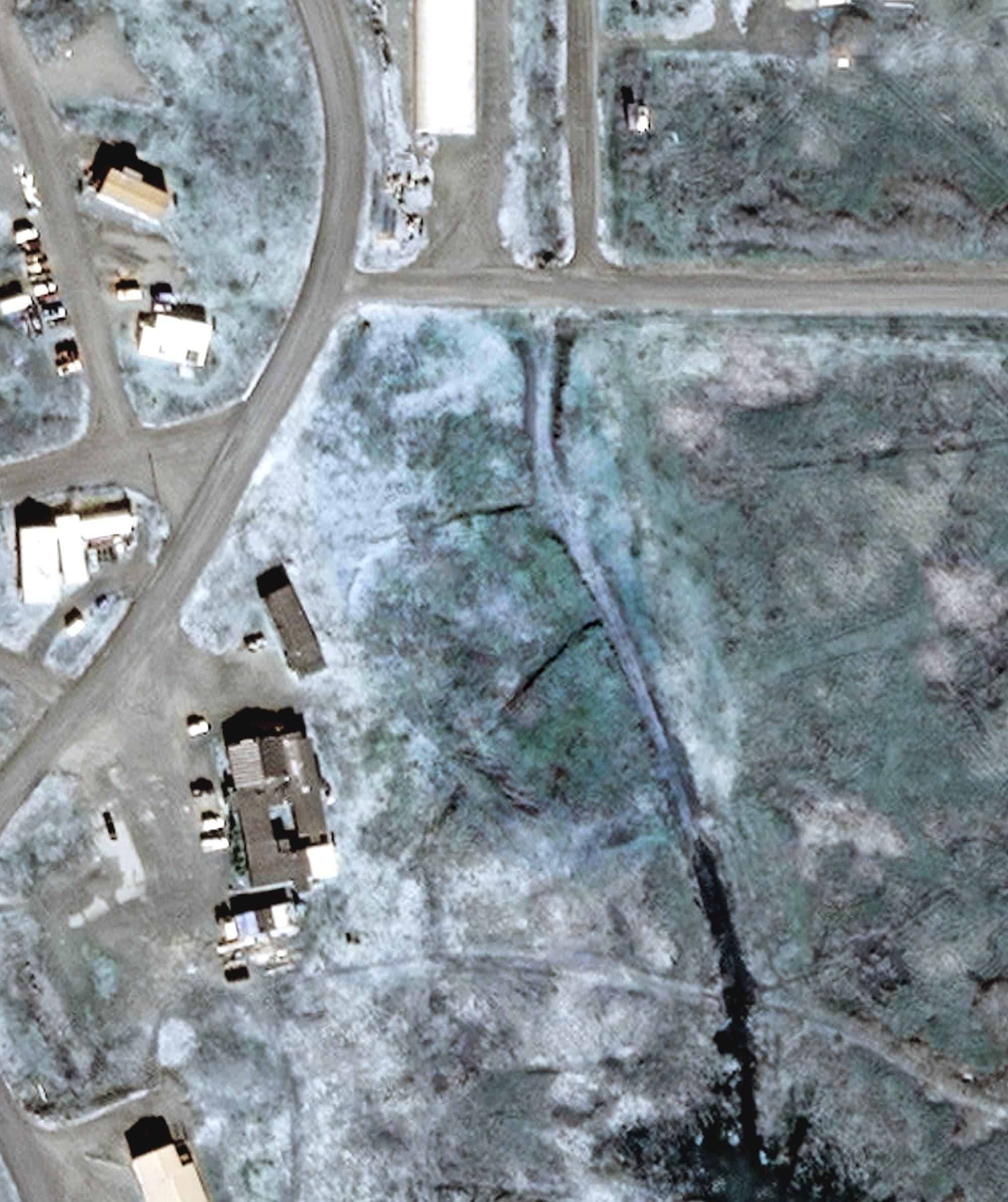 Aerial view of Cold Bay Golf Course, AK, with its hole routing marked
