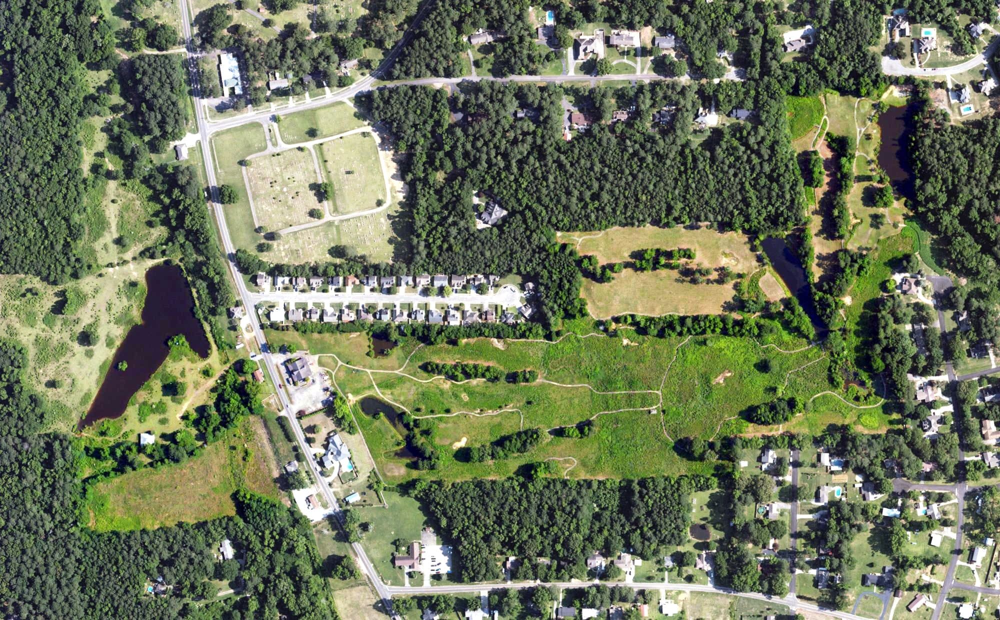 Aerial view of Magnolia Meadows Golf Course, AL, with its hole routing marked