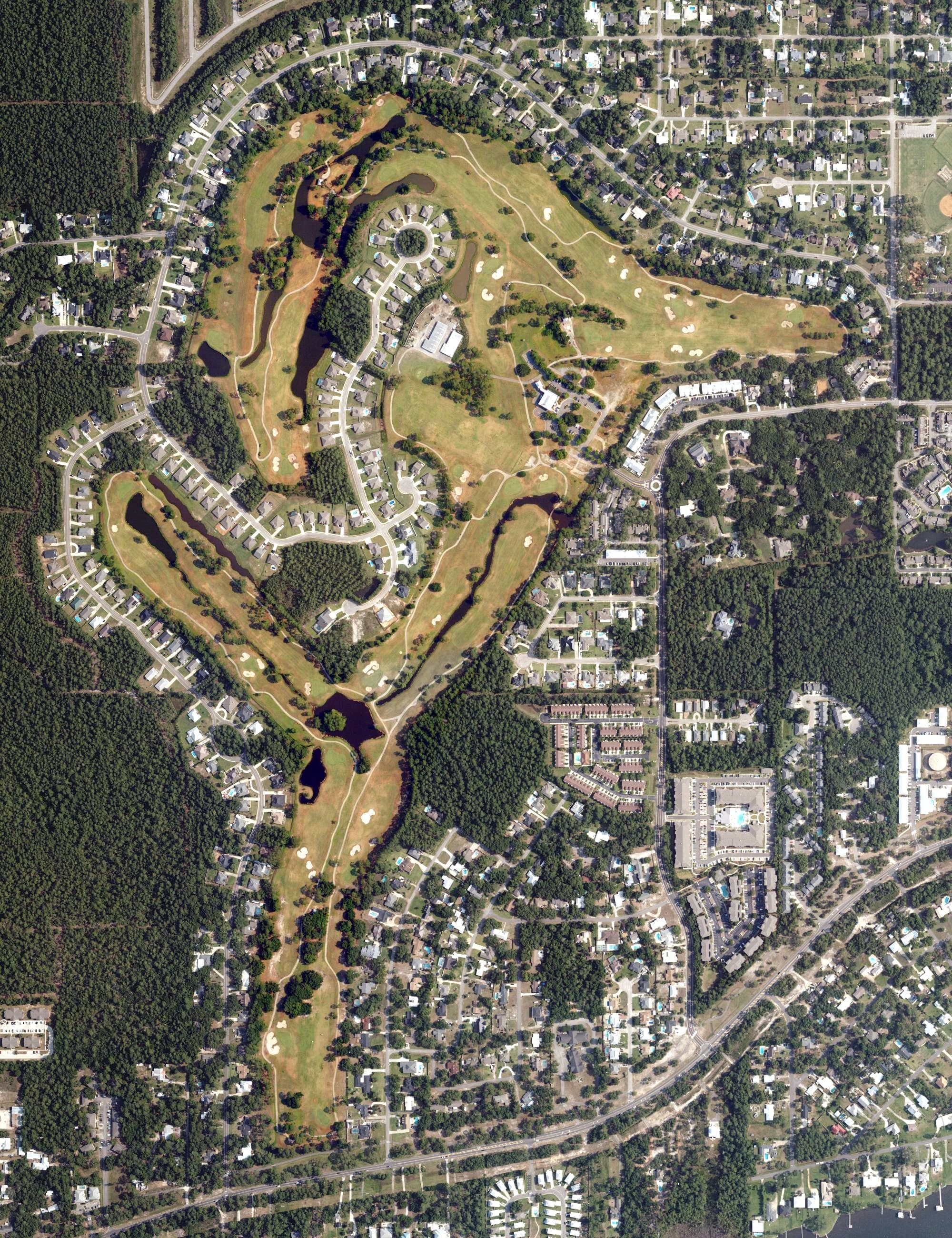 Aerial view of The Golf Club of the Wharf, AL, with its hole routing marked
