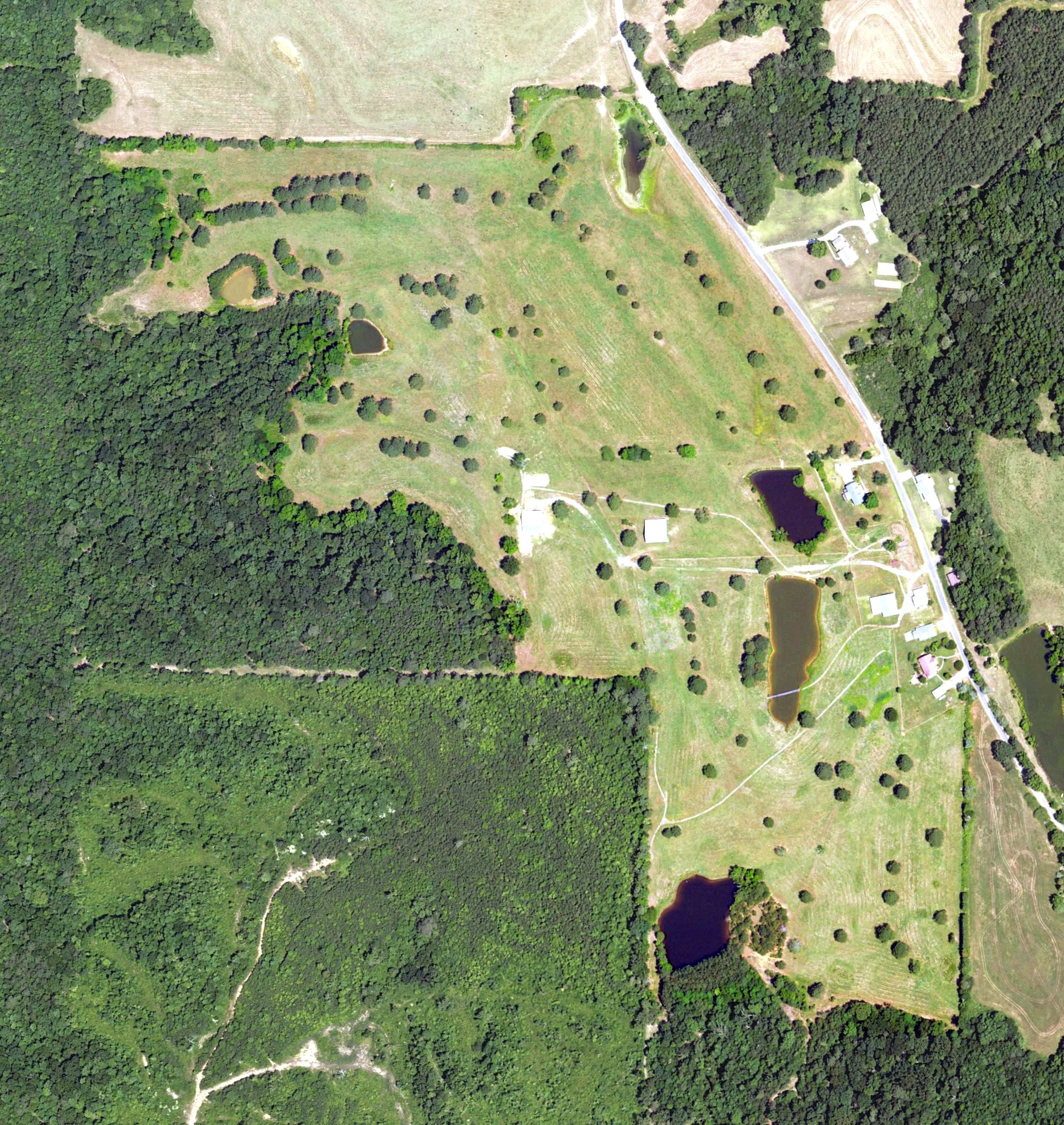 Aerial view of Whispering Pines Golf Course, AL, with its hole routing marked