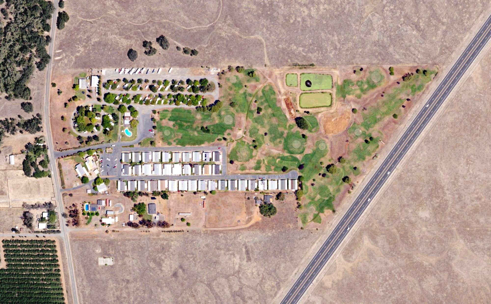 Aerial view of Dingerville USA Golf Club & RV Resort, CA, with its hole routing marked