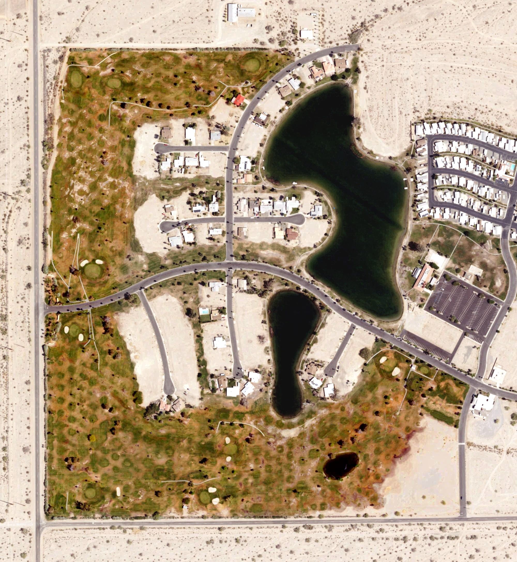 Aerial view of Lake Tamarisk Golf Course, CA, with its hole routing marked