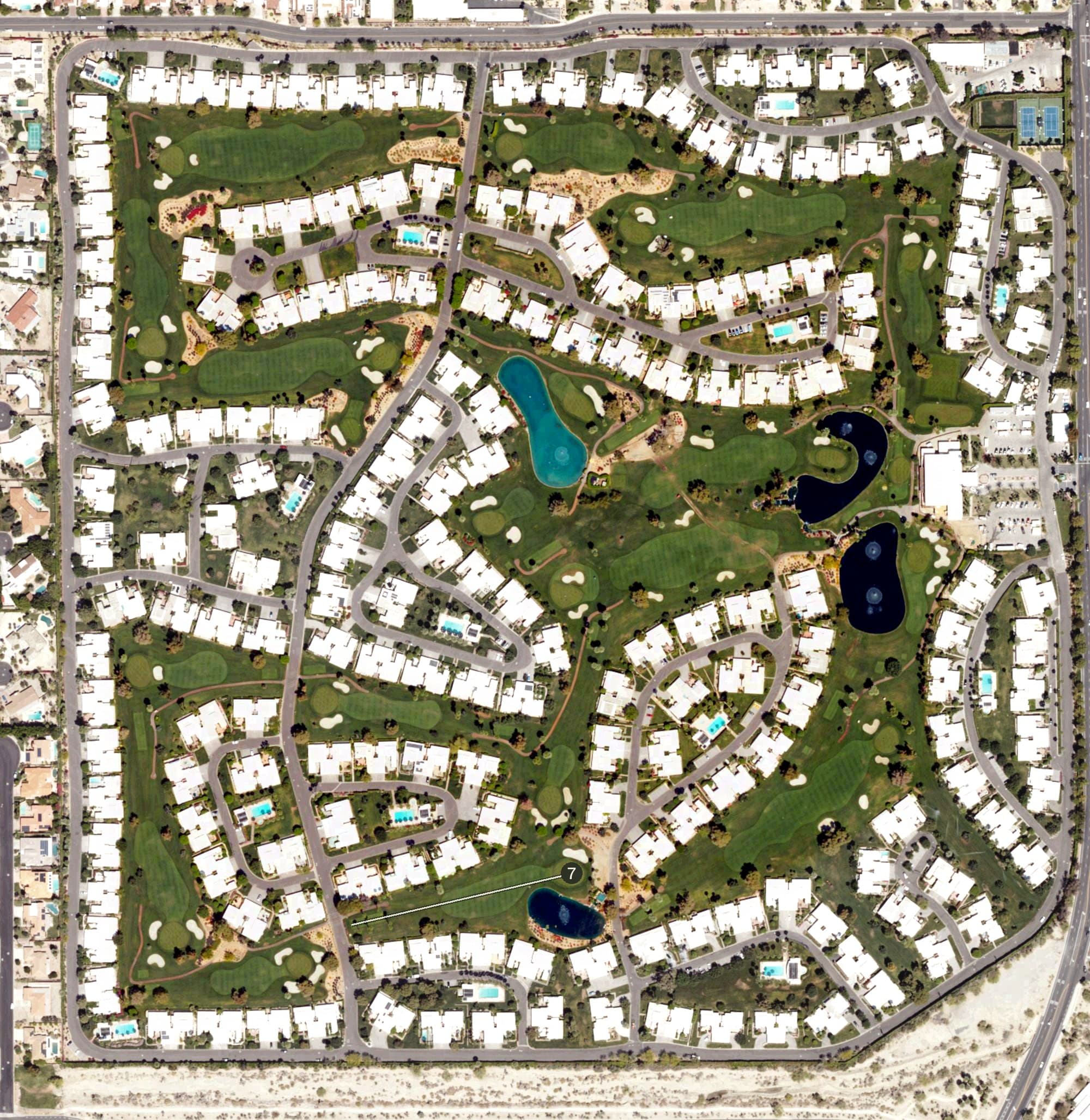 Aerial view of Marrakesh Country Club, CA, with its hole routing marked