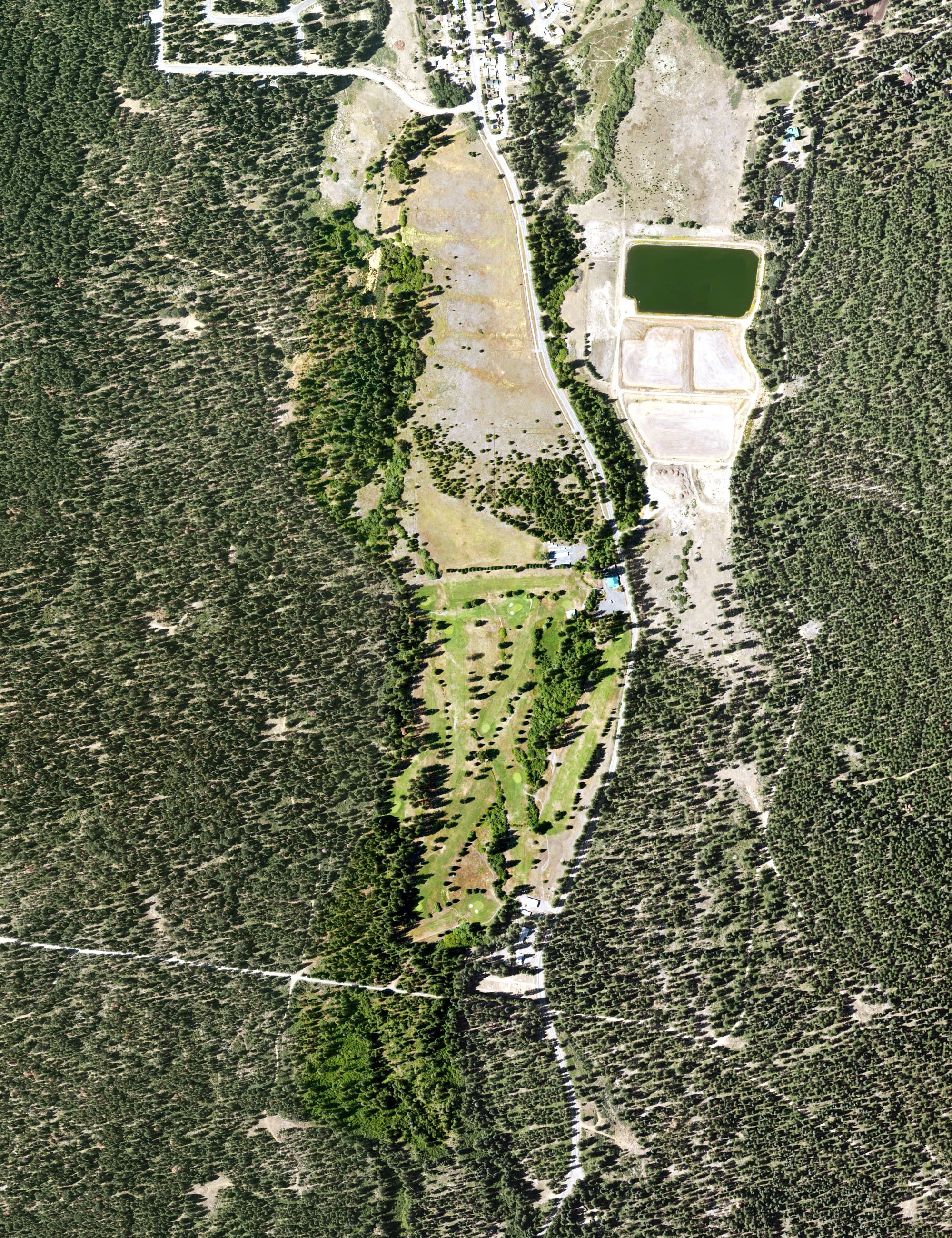Aerial view of McCloud Golf Club, CA, with its hole routing marked