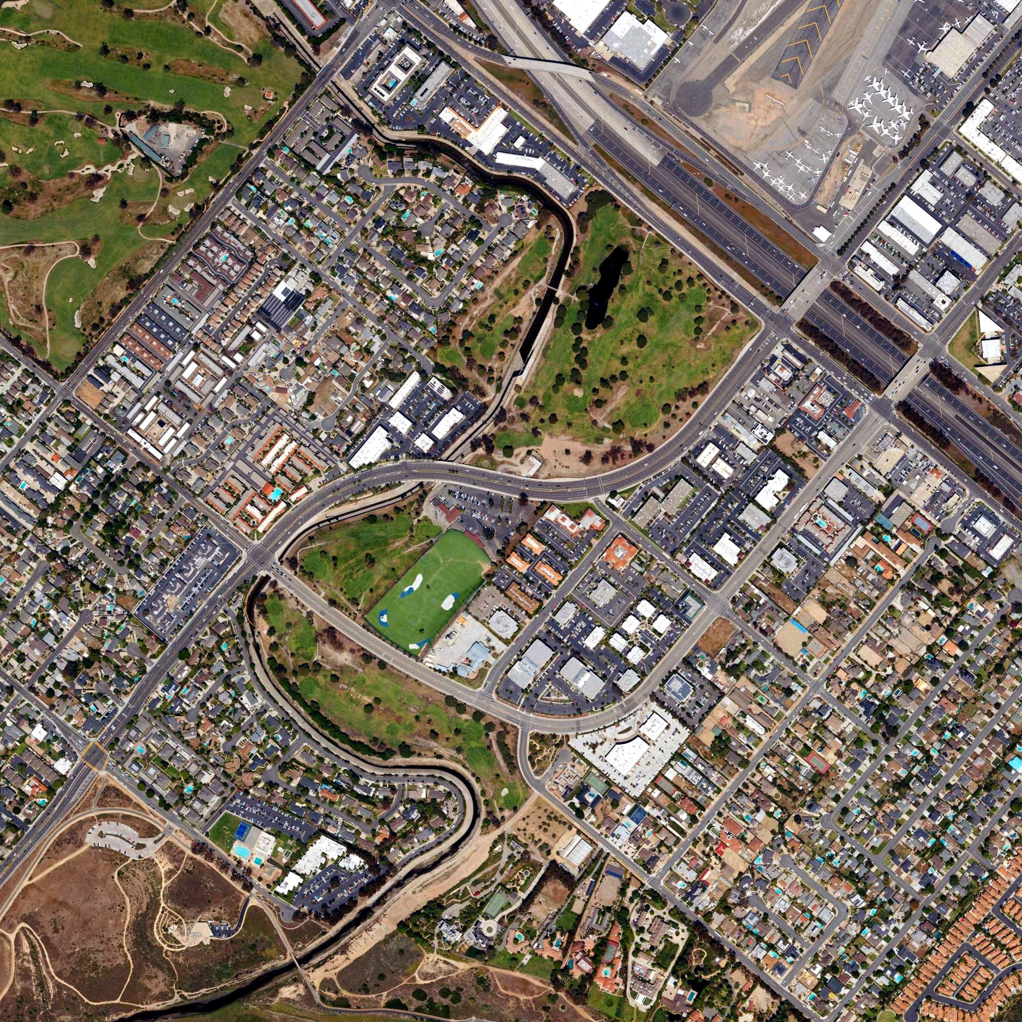 Aerial view of Newport Beach Golf Course, CA, with its hole routing marked