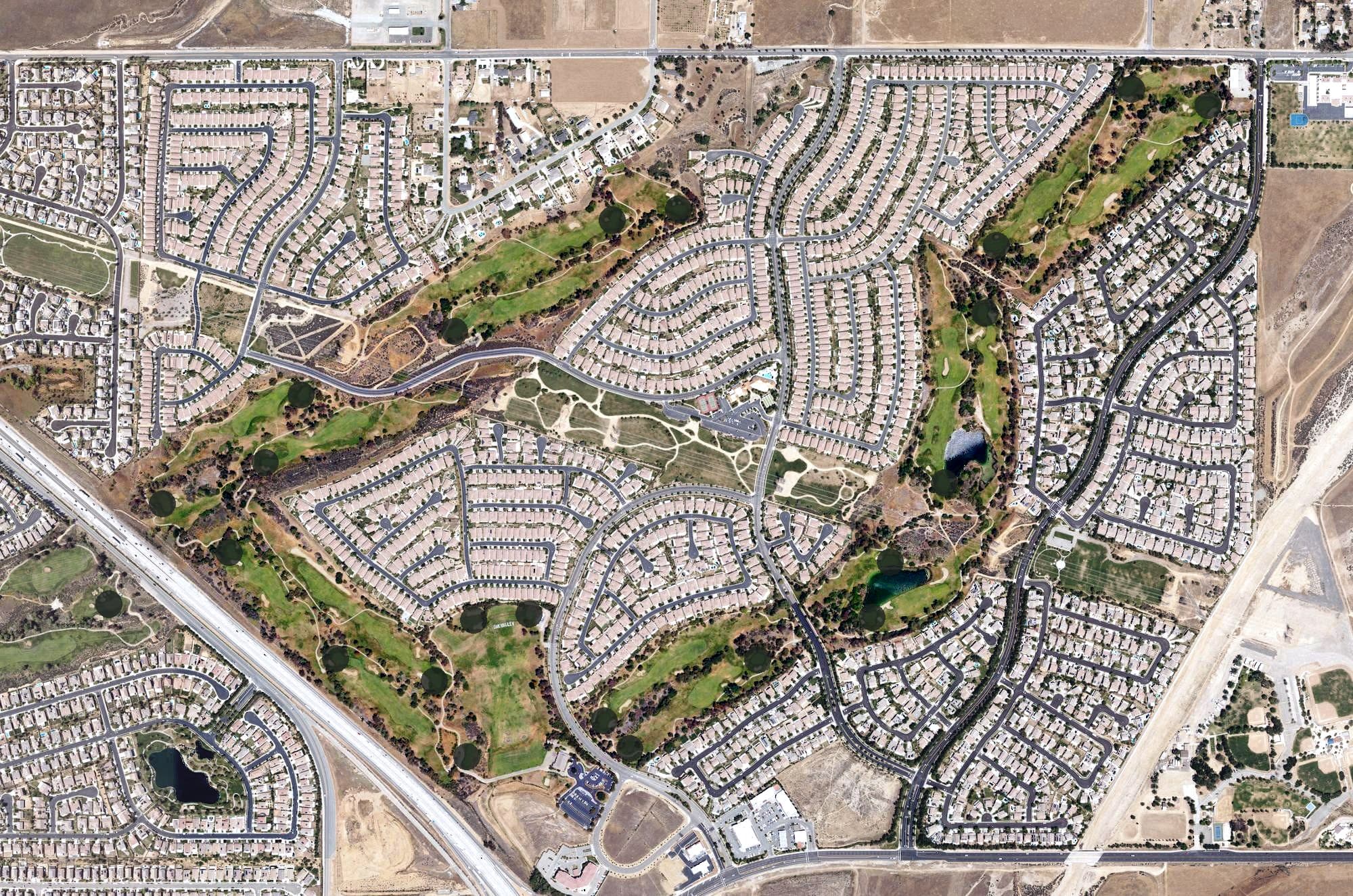 Aerial view of Oak Valley Golf Club, CA, with its hole routing marked