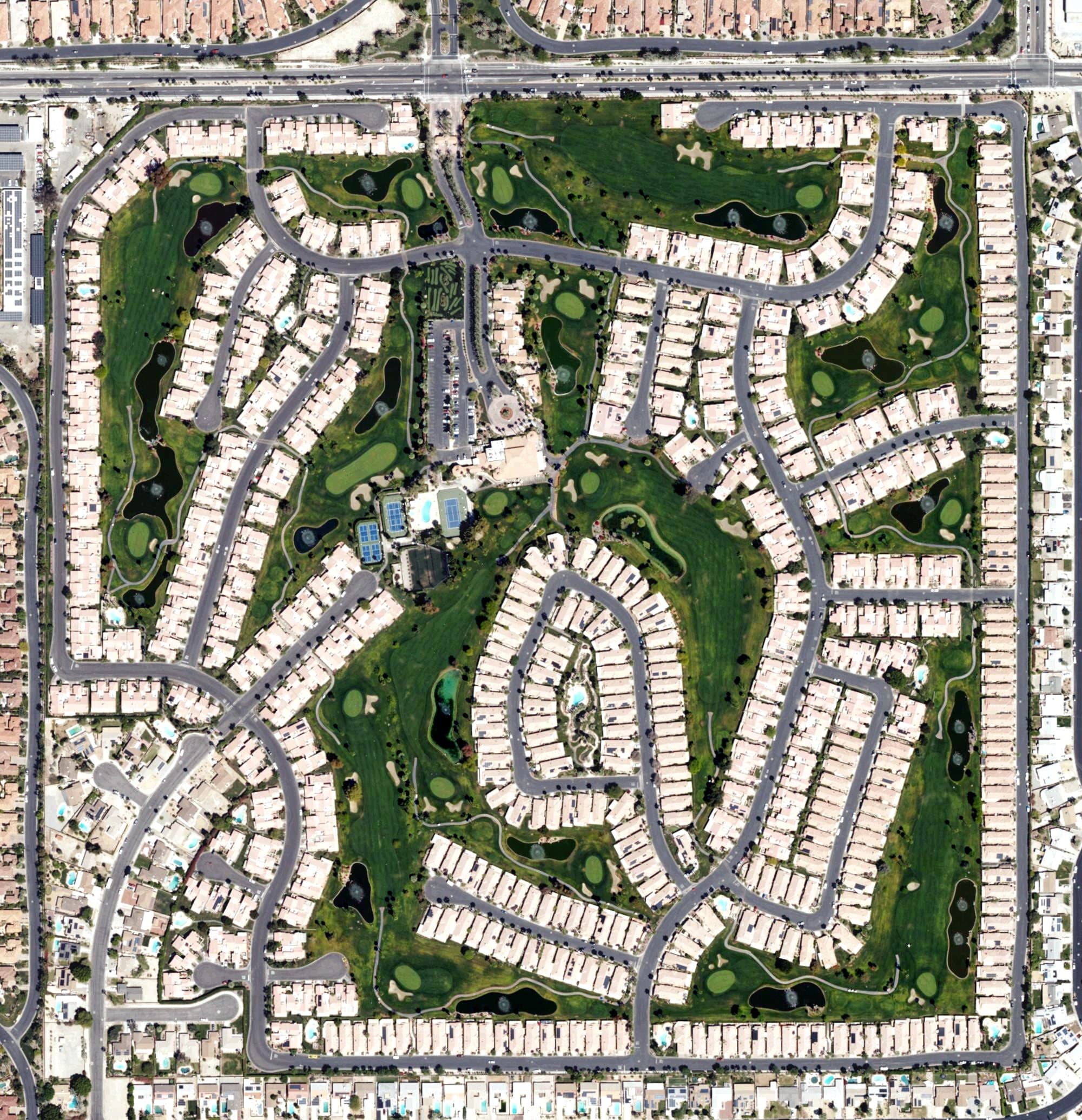 Aerial view of Oasis Country Club Golf Course, CA, with its hole routing marked