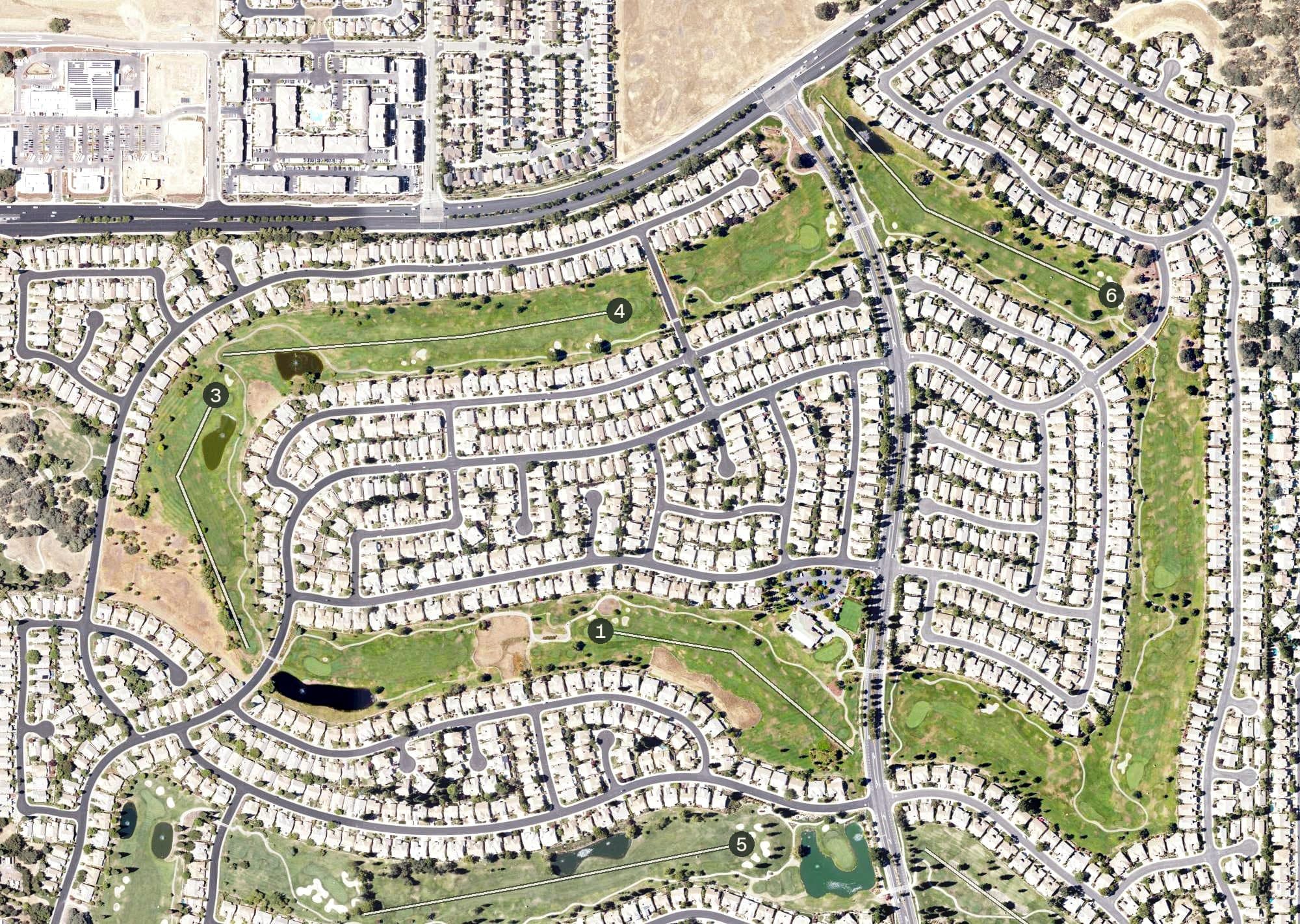 Aerial view of Sun City Sierra Pines Golf Course, CA, with its hole routing marked
