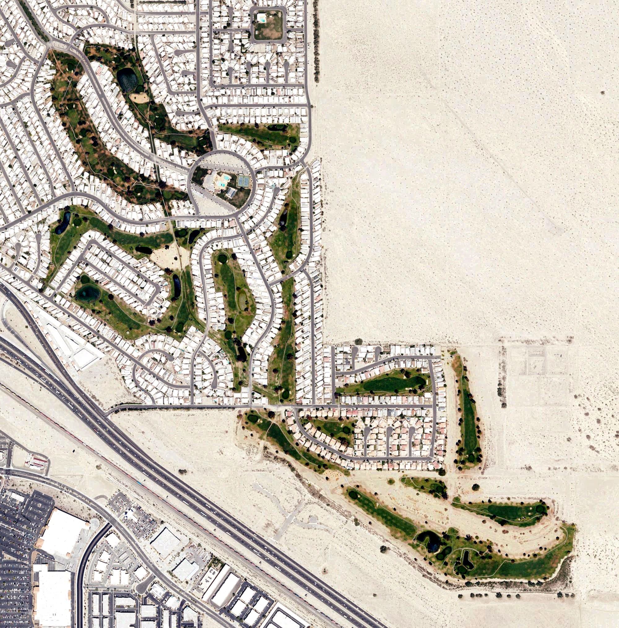Aerial view of Tri Palm County Club, CA, with its hole routing marked