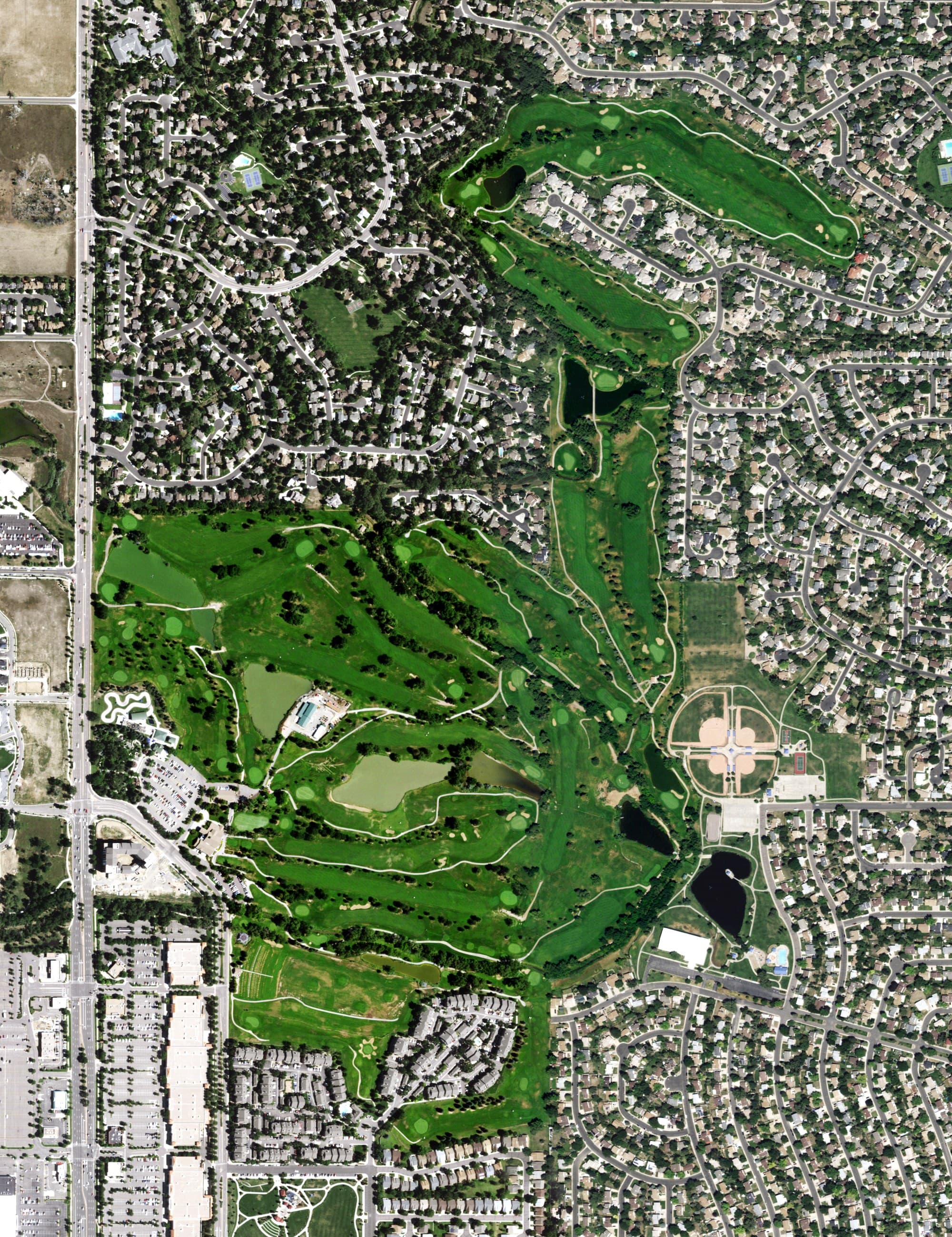 Aerial view of The Greg Mastriona Golf Courses at Hyland Hills, CO, with its hole routing marked