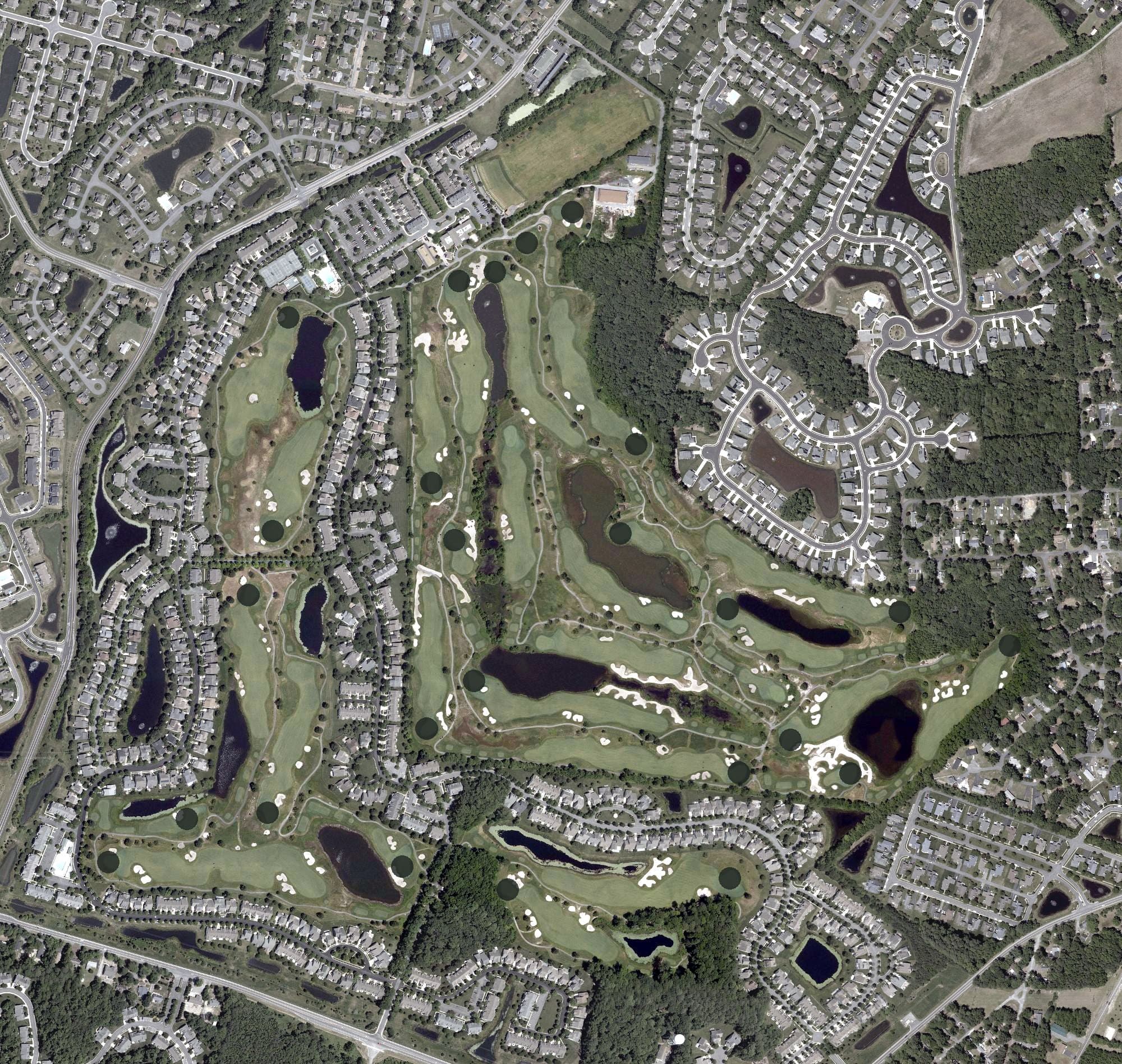 Aerial view of Bear Trap Dunes Golf Course, DE, with its hole routing marked