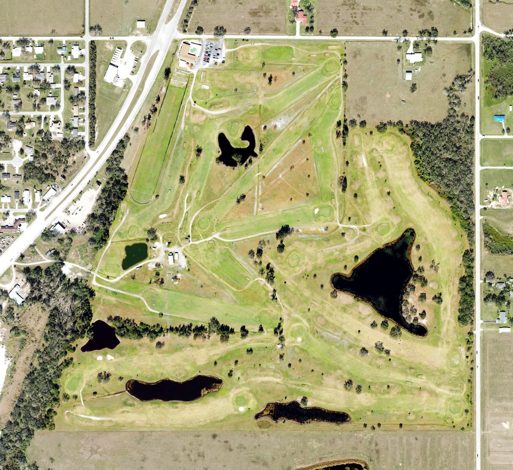 Aerial view of Arcadia Municipal Golf Course, FL, with its hole routing marked