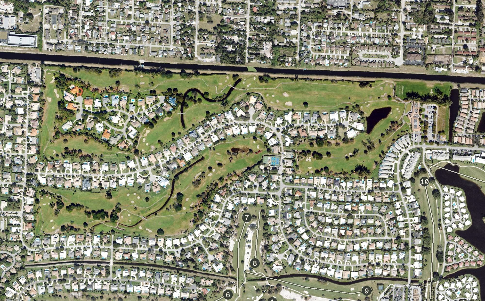 Aerial view of Atlantis Country Club, FL, with its hole routing marked