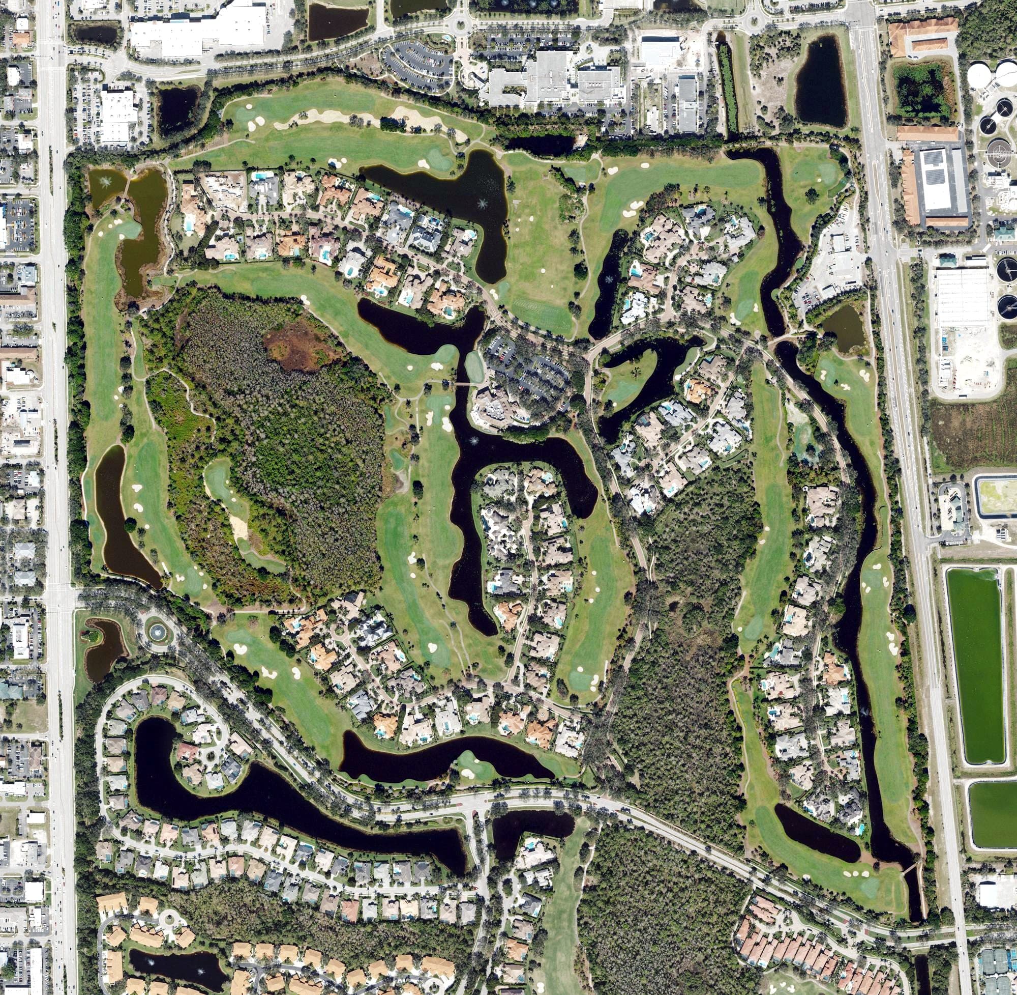 Aerial view of Bay Colony Golf Club, FL, with its hole routing marked