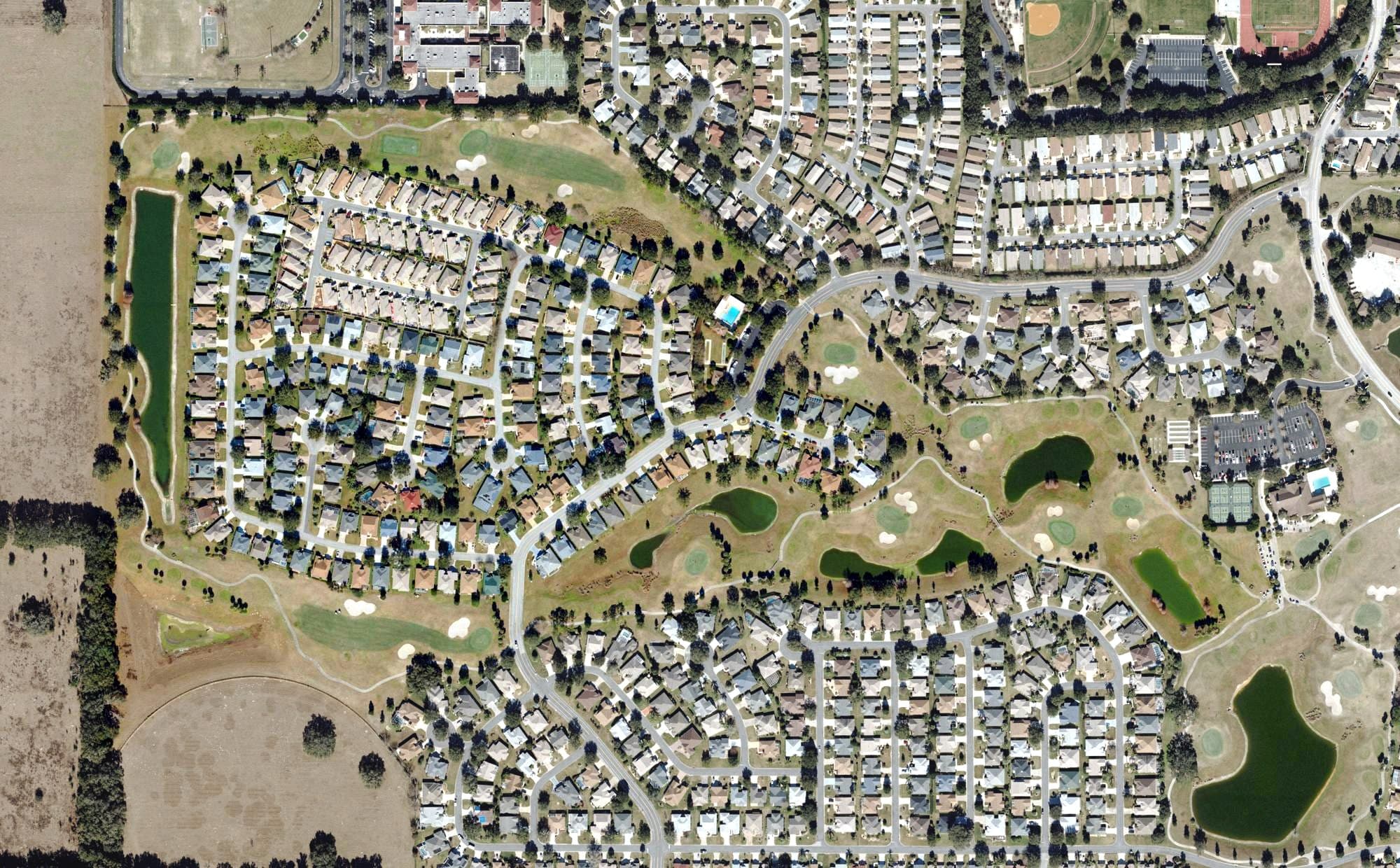 Aerial view of Churchill Greens Golf Course (The Villages), FL, with its hole routing marked