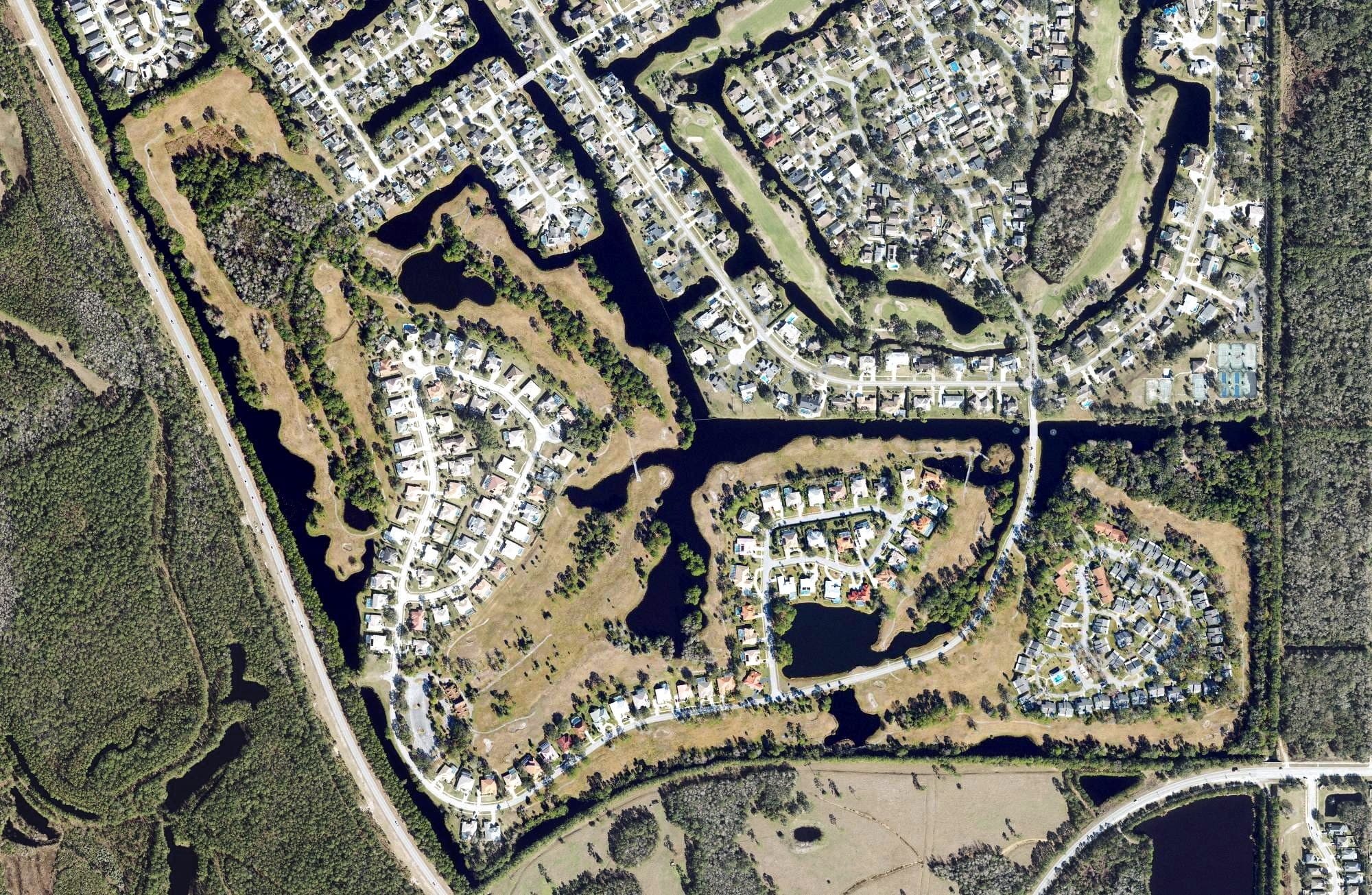 Aerial view of Club at Pelican Bay South Course, FL, with its hole routing marked