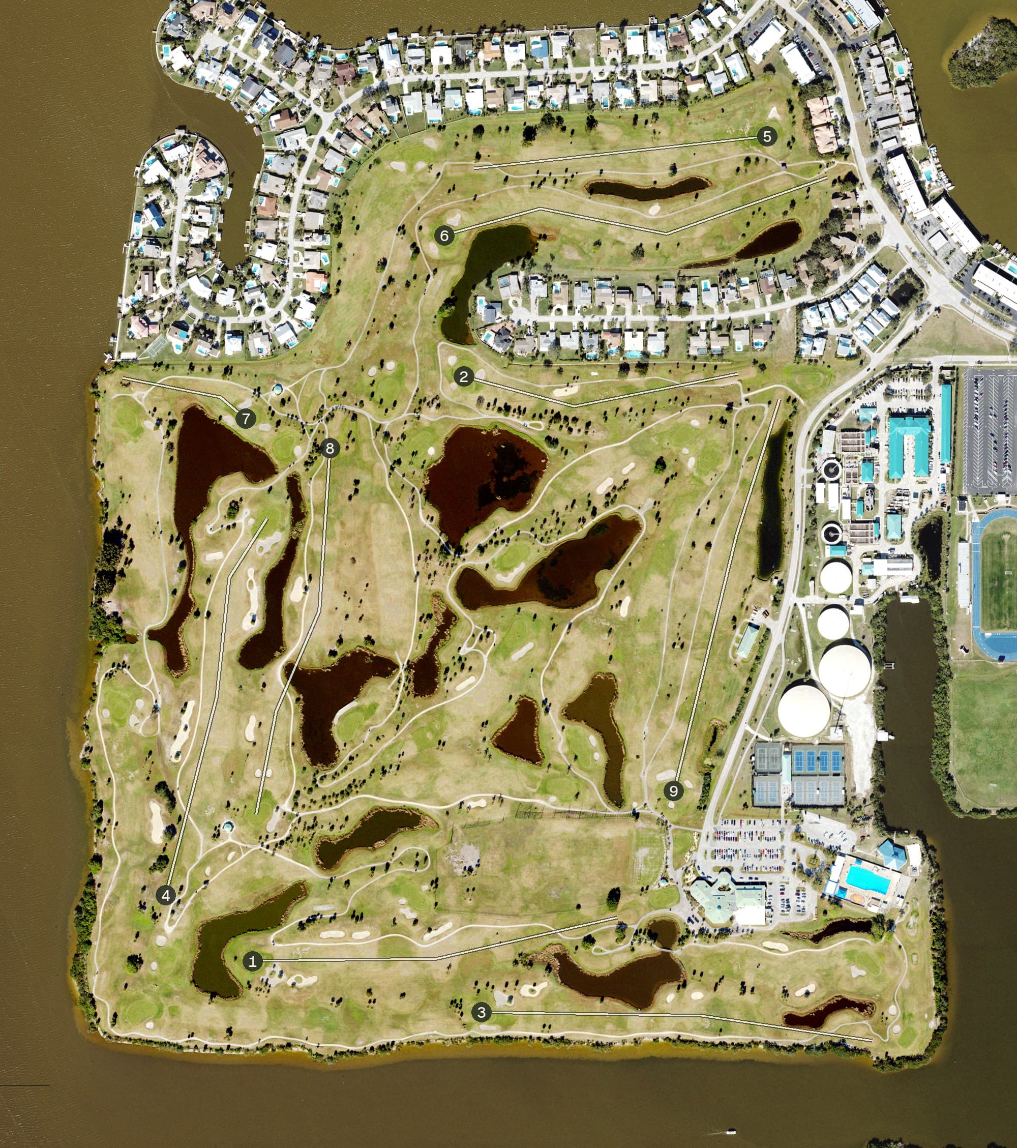 Aerial view of Cocoa Beach Country Club, FL, with its hole routing marked