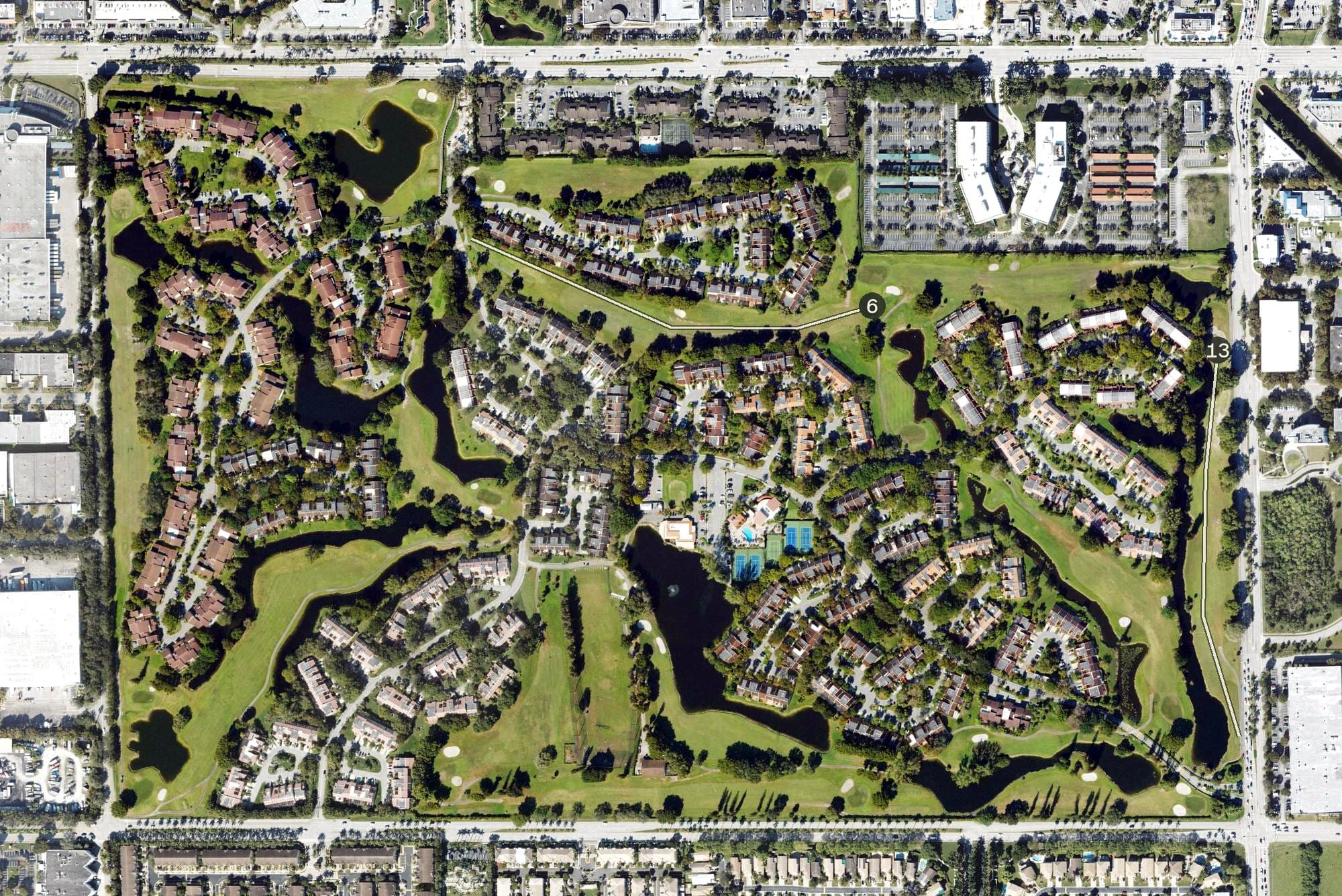 Aerial view of Costa Del Sol Golf Club, FL, with its hole routing marked