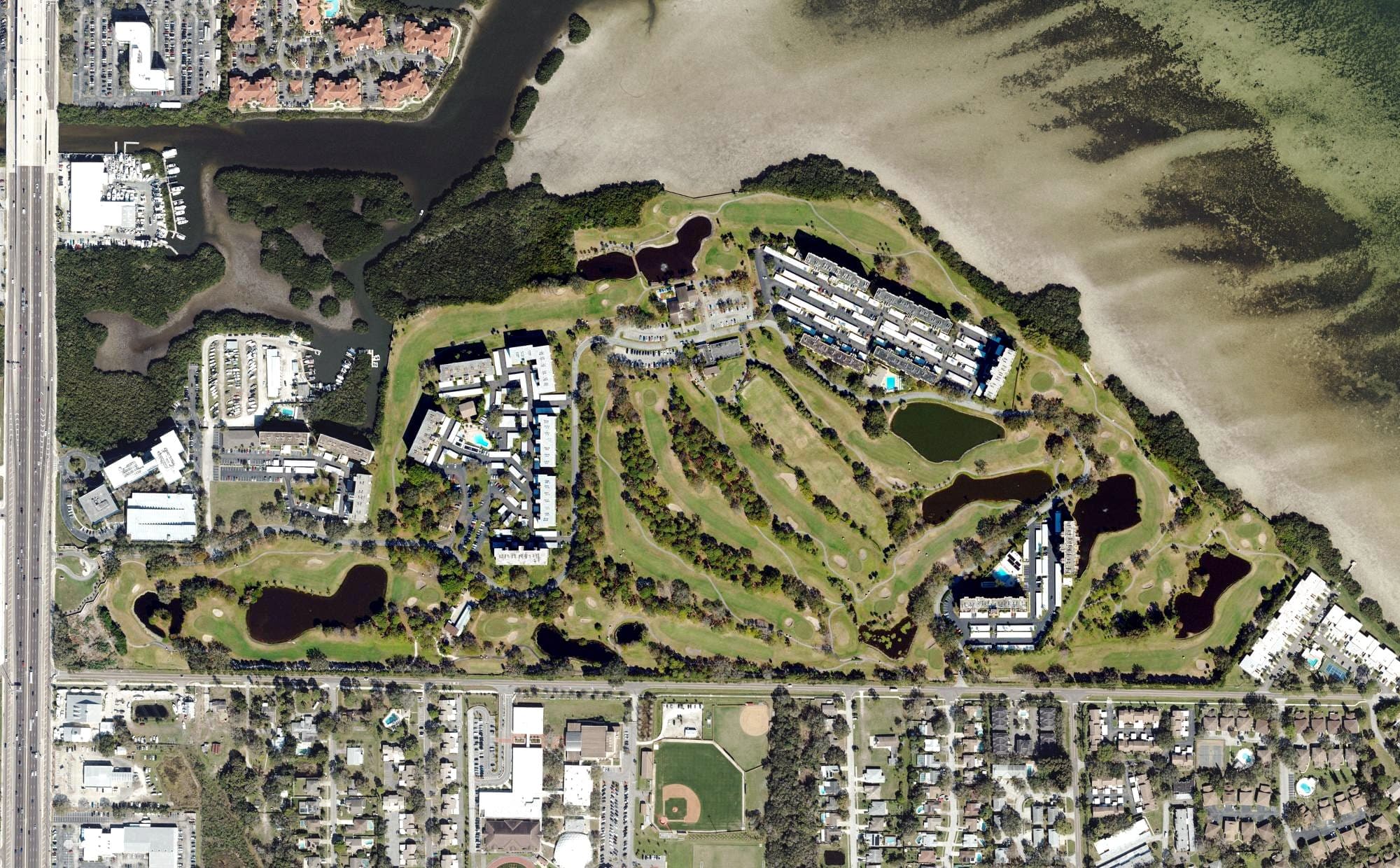 Aerial view of Cove Cay Country Club, FL, with its hole routing marked