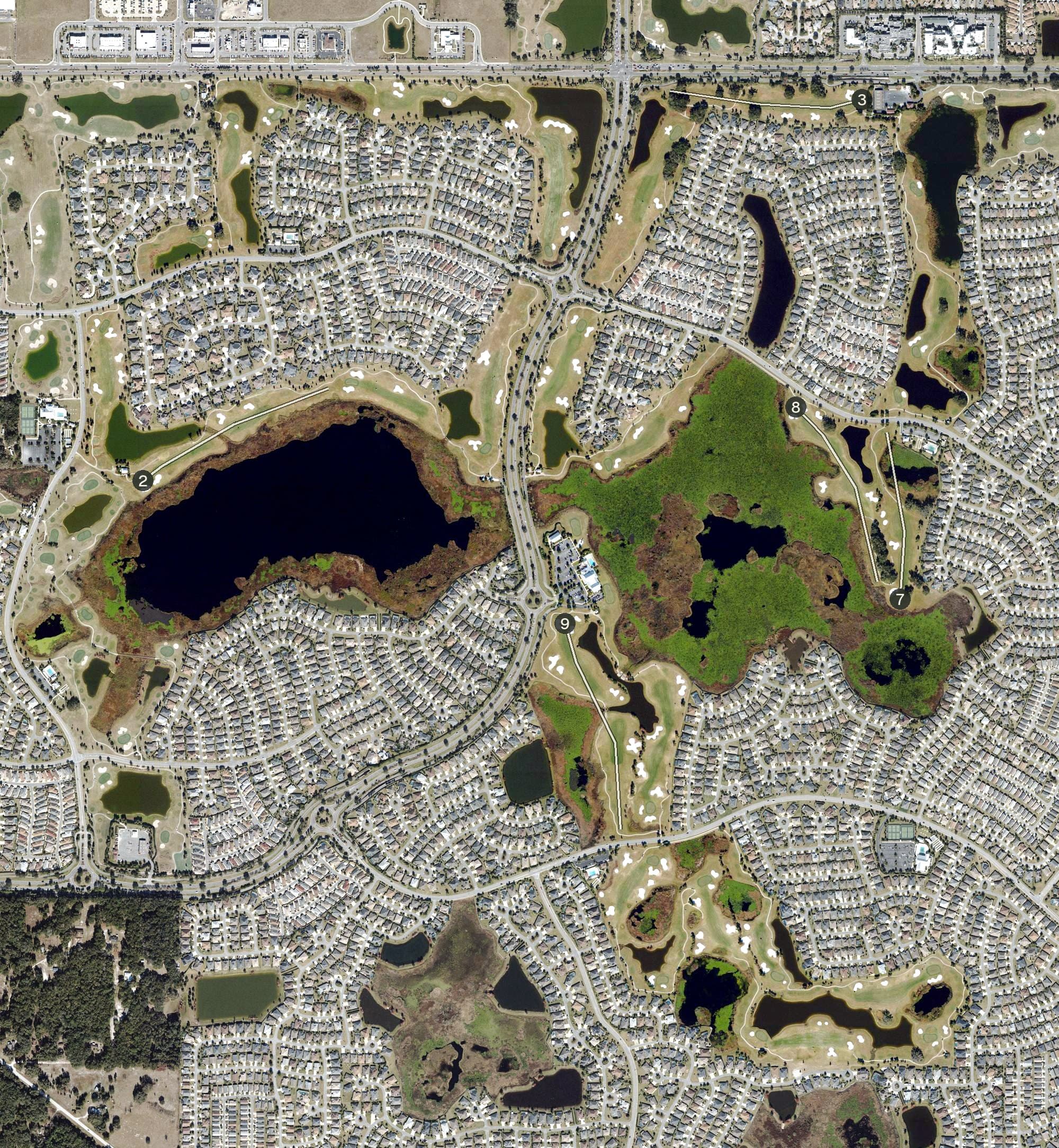 Aerial view of Evans Prairie Country Club (The Villages), FL, with its hole routing marked