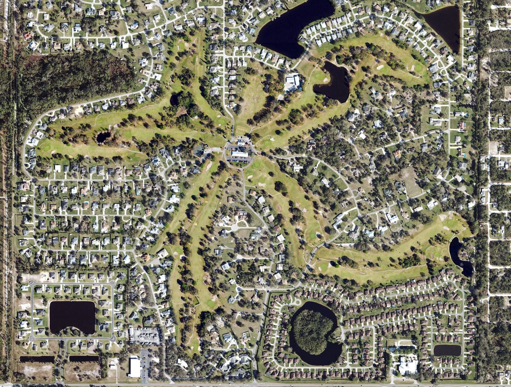 Aerial view of Golf Hammock Golf and Country Club, FL, with its hole routing marked