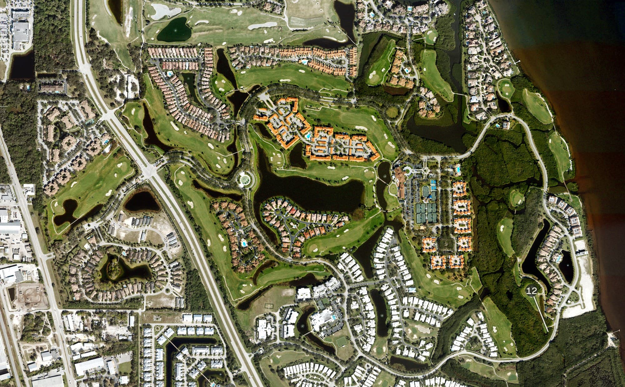 Aerial view of Grand Harbor - River Course, FL, with its hole routing marked
