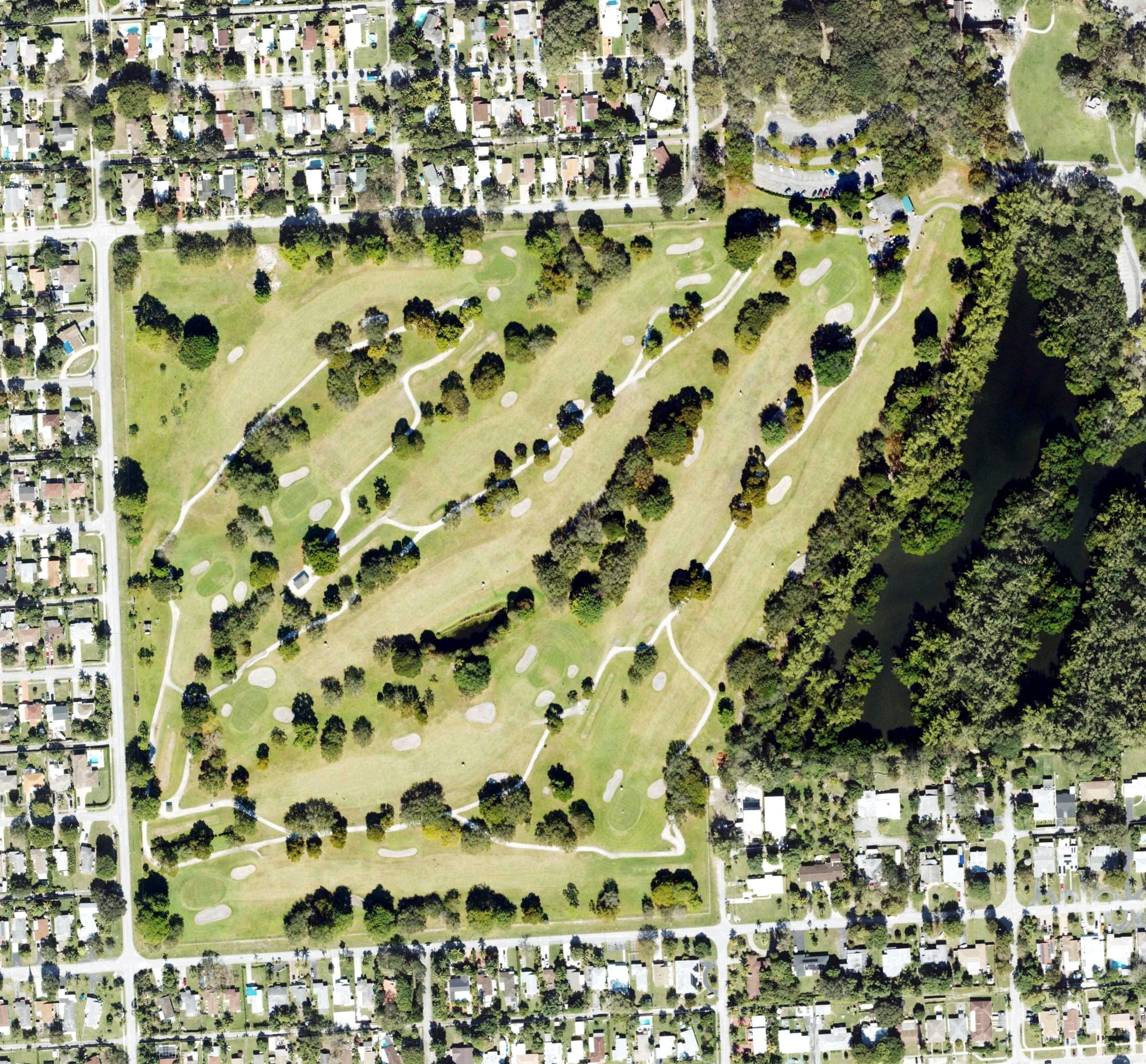 Aerial view of Greynolds Golf Course, FL, with its hole routing marked