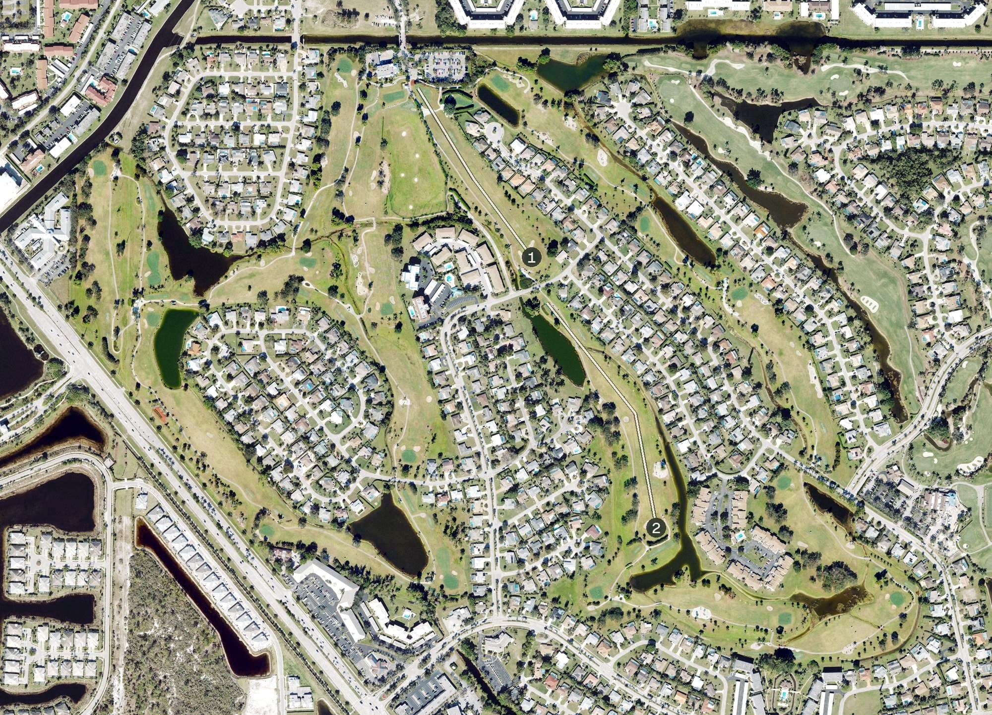 Aerial view of Hibiscus Golf Club, FL, with its hole routing marked