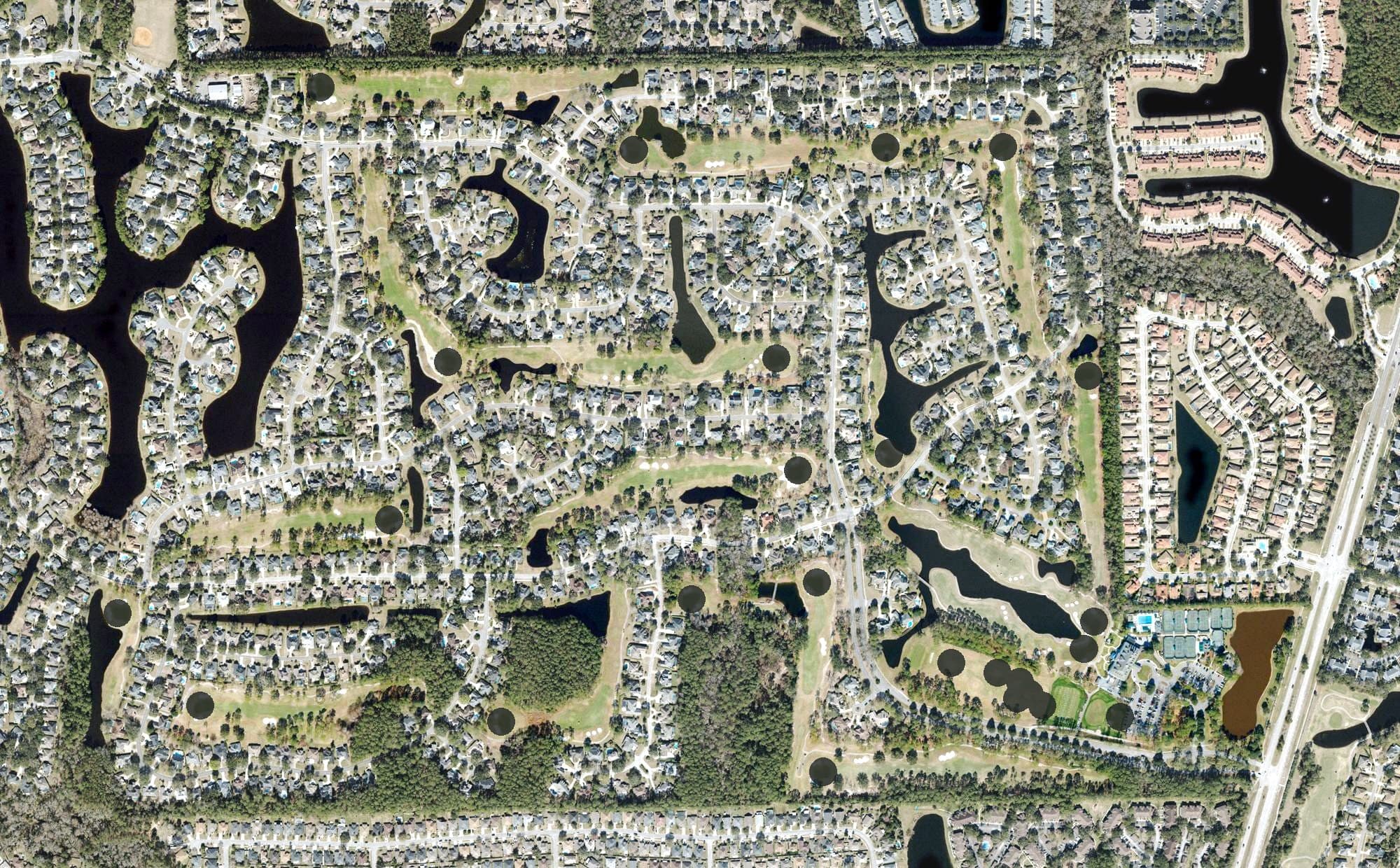 Aerial view of Jacksonville Golf & Country Club, FL, with its hole routing marked