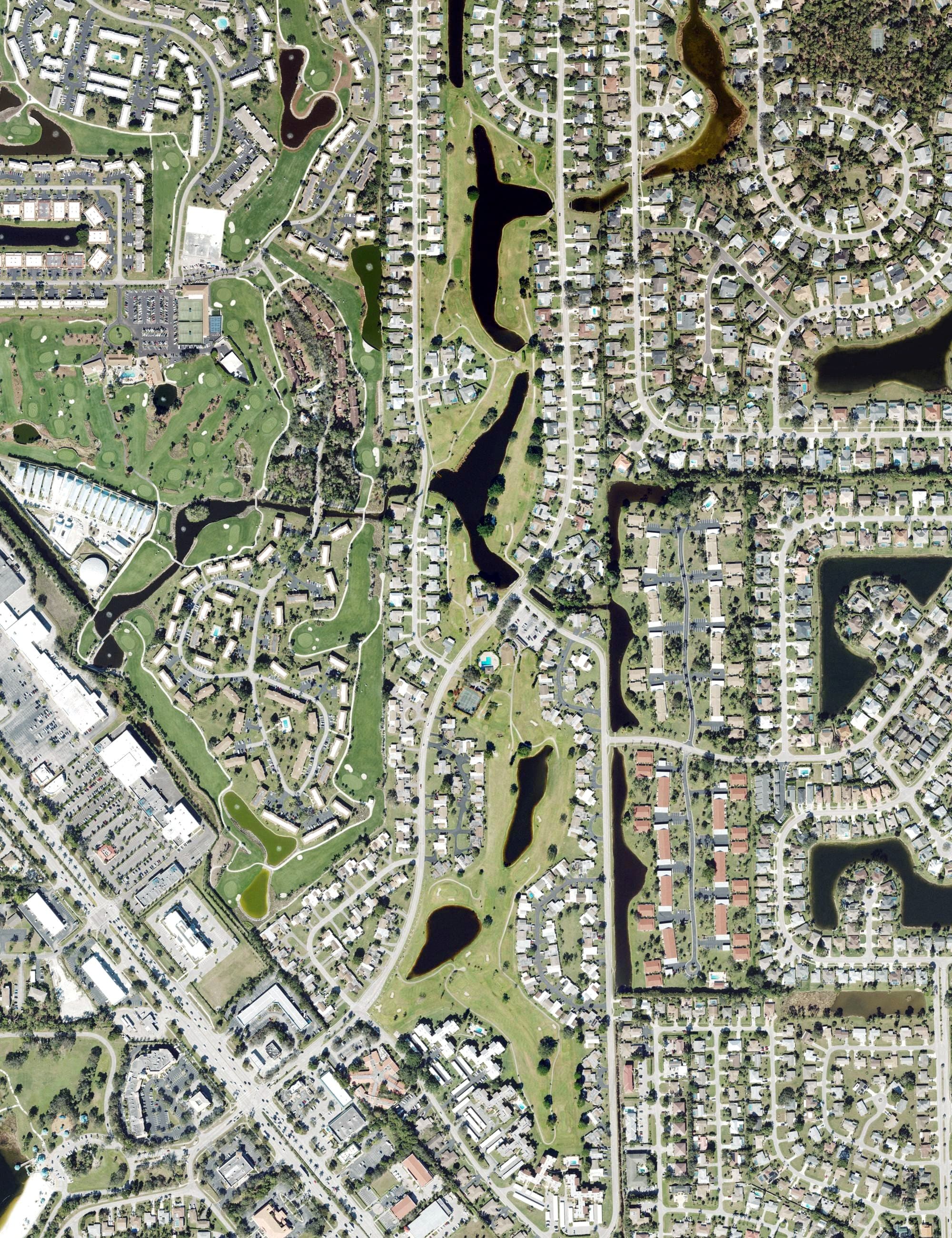Aerial view of Lakewood Country Club of Naples, FL, with its hole routing marked