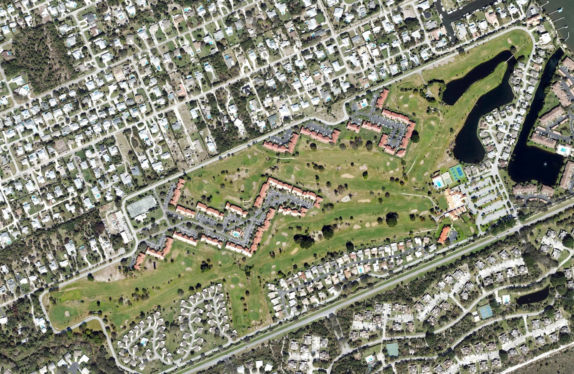 Aerial view of Miles Grant Country Club, FL, with its hole routing marked