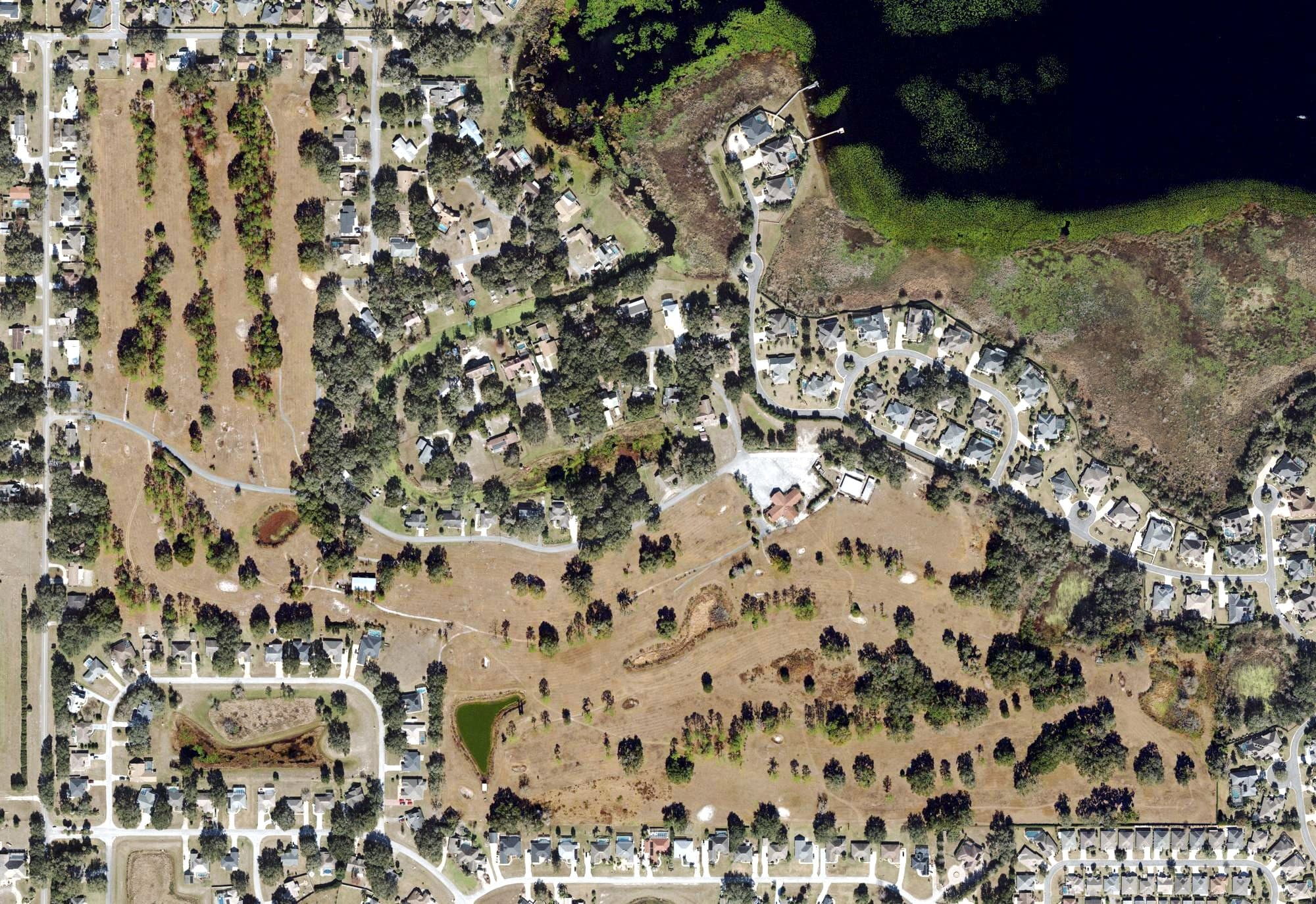 Aerial view of Miona Lake Golf Club, FL, with its hole routing marked