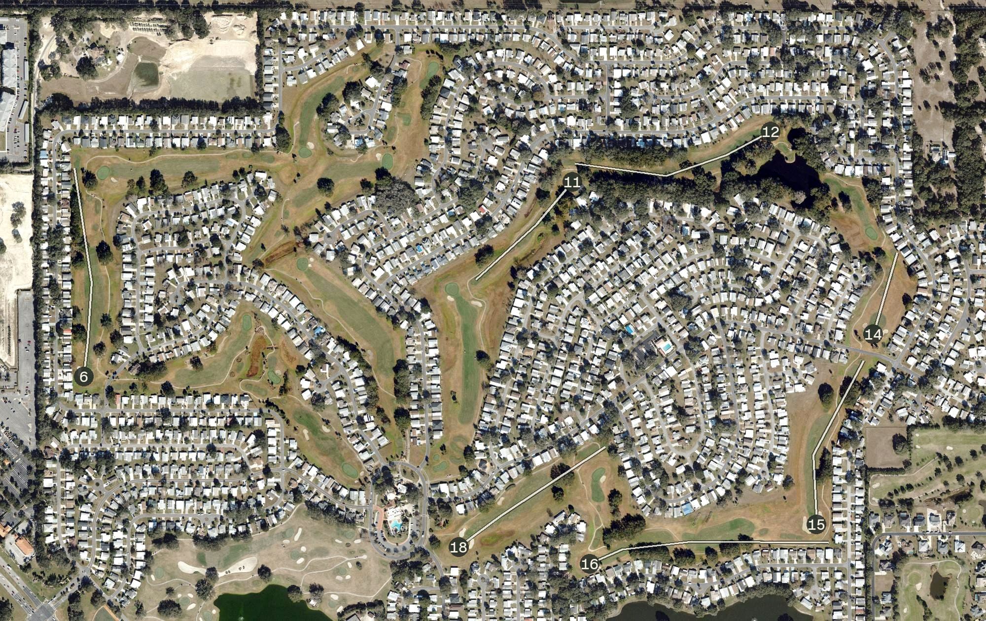 Aerial view of Orange Blossom Hills Golf & Country Club (The Villages), FL, with its hole routing marked
