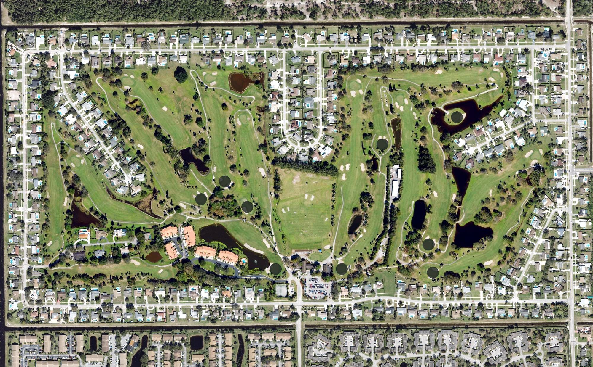 Aerial view of Palm Beach National Golf and Country Club, FL, with its hole routing marked