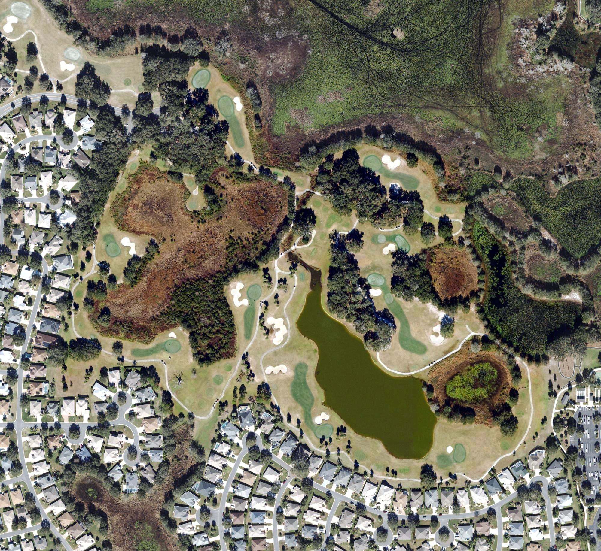 Aerial view of Pelican Golf Course (The Villages), FL, with its hole routing marked
