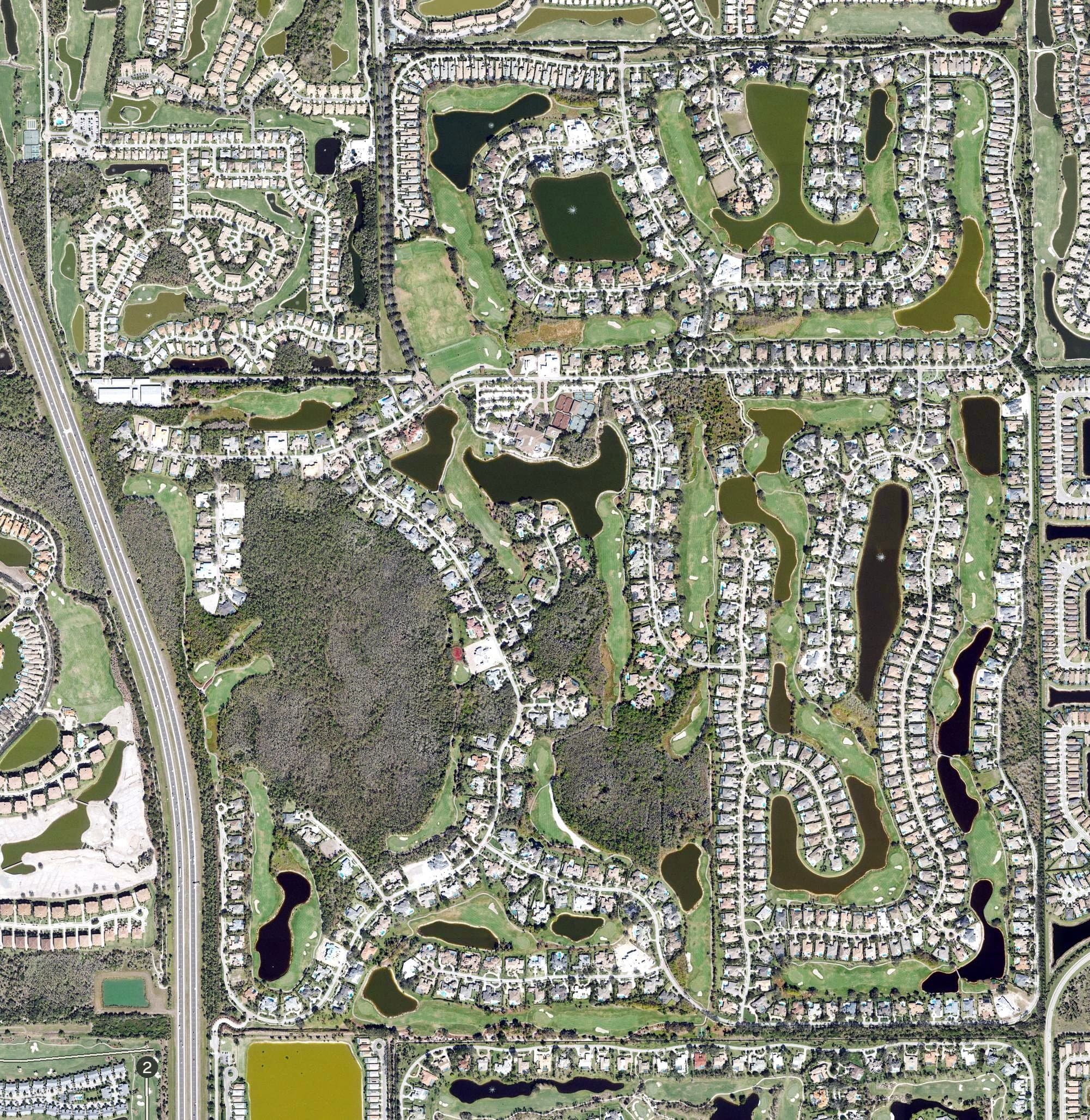 Aerial view of Quail West Golf & Country Club, FL, with its hole routing marked