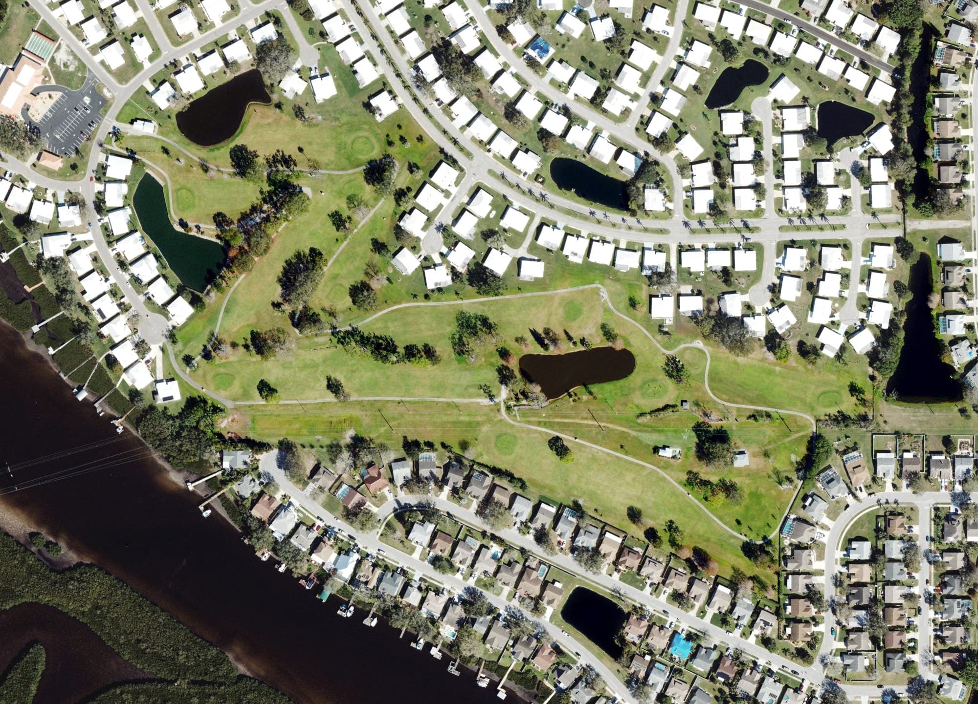 Aerial view of River Isles Golf Course, FL, with its hole routing marked