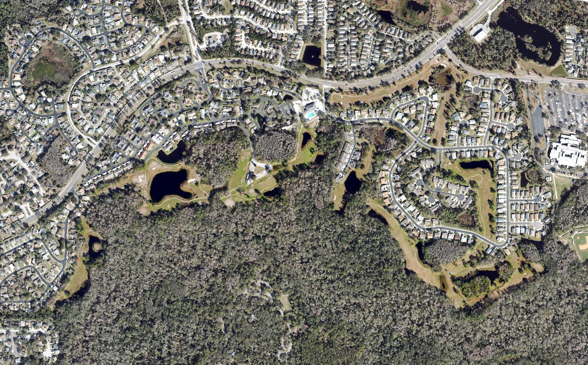Aerial view of River Ridge Golf and Country Club, FL, with its hole routing marked