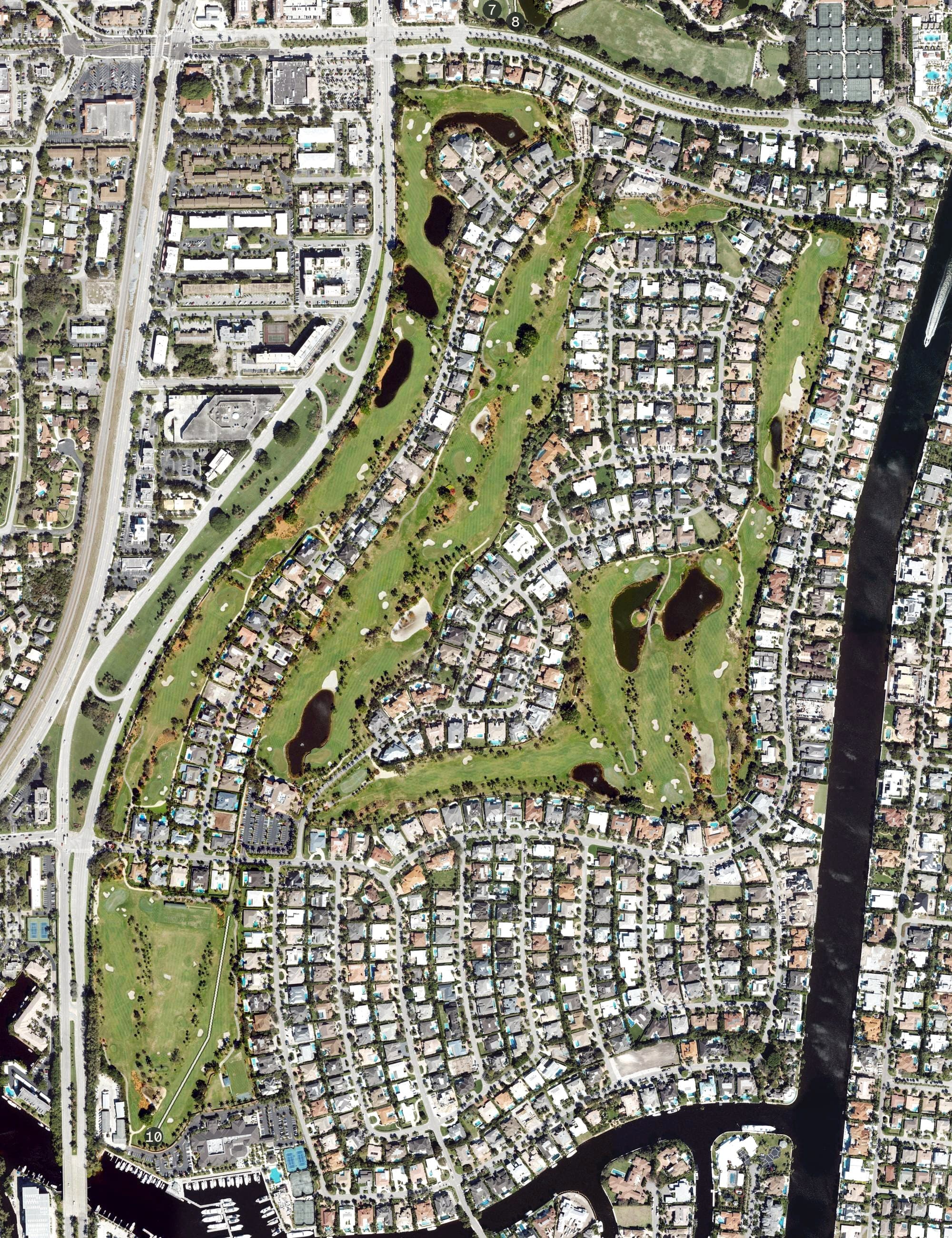 Aerial view of Royal Palm Yacht & Country Club, FL, with its hole routing marked