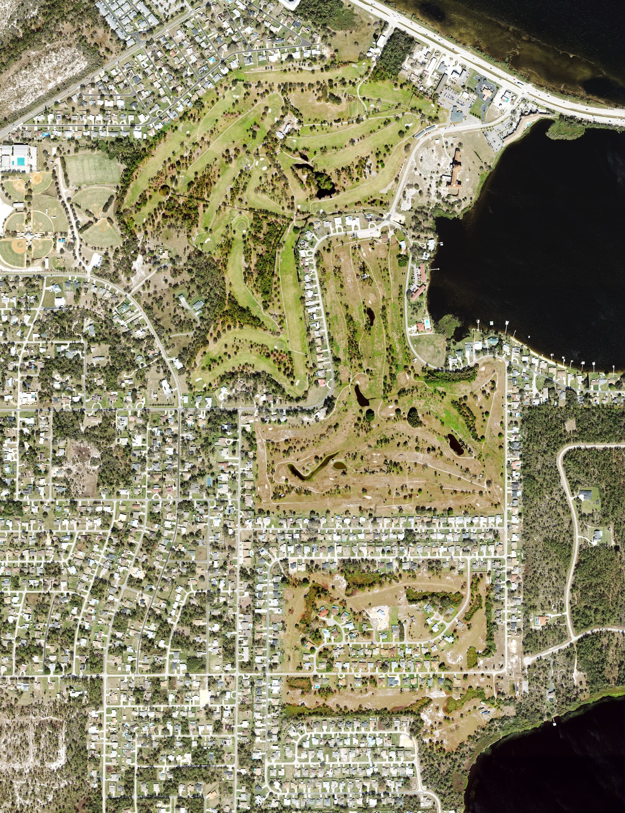 Aerial view of Sebring Municipal Golf Course, FL, with its hole routing marked