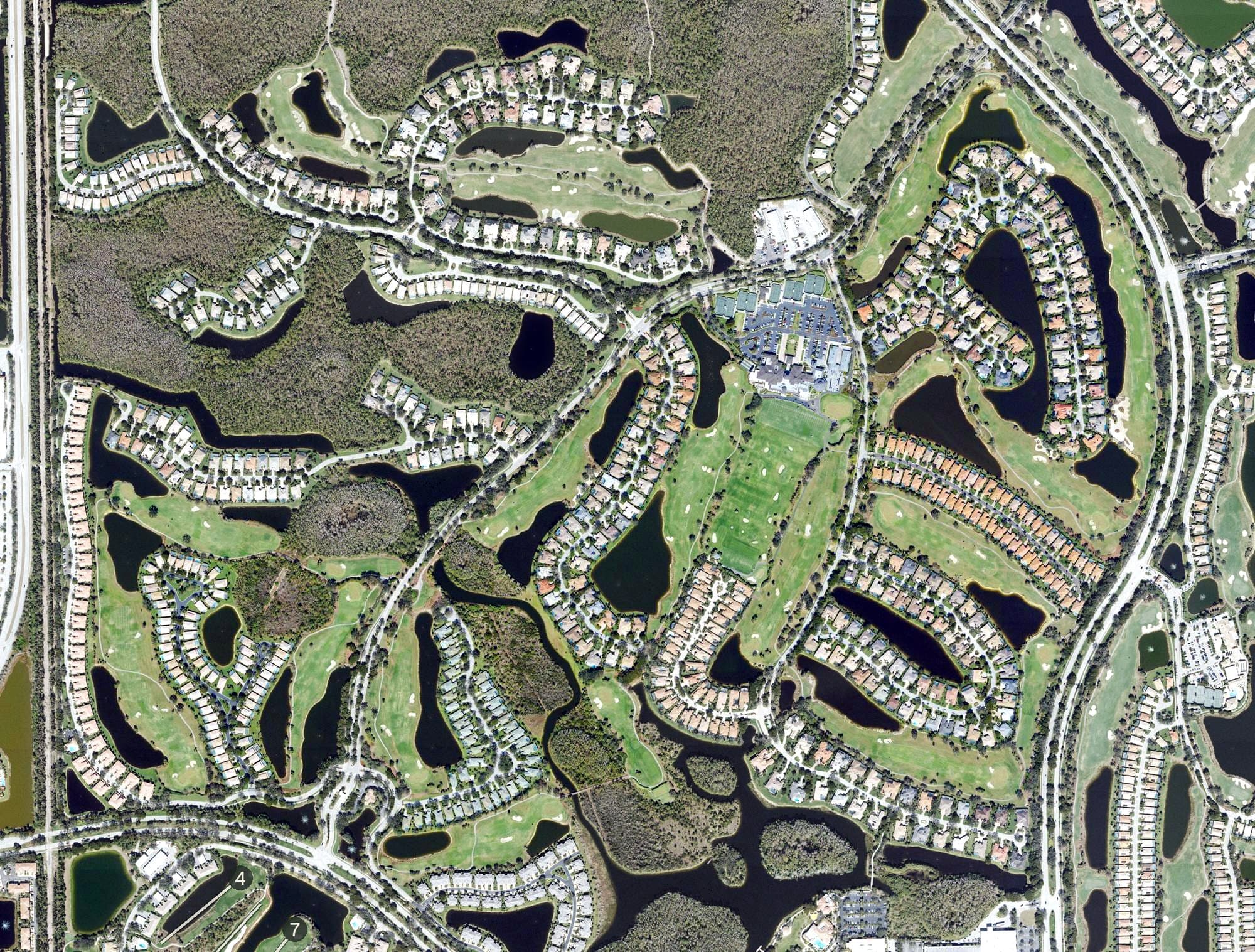 Aerial view of Shadow Wood Country Club - South Course, FL, with its hole routing marked