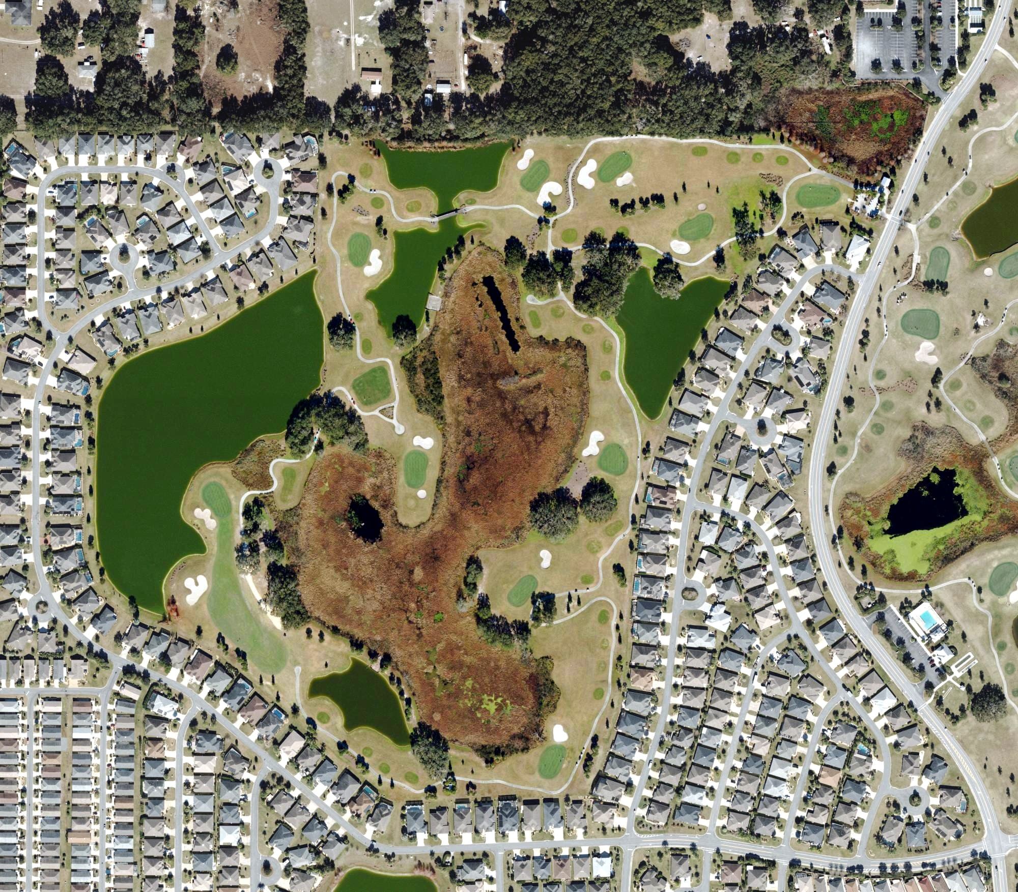Aerial view of Sweetgum Golf Course (The Villages), FL, with its hole routing marked