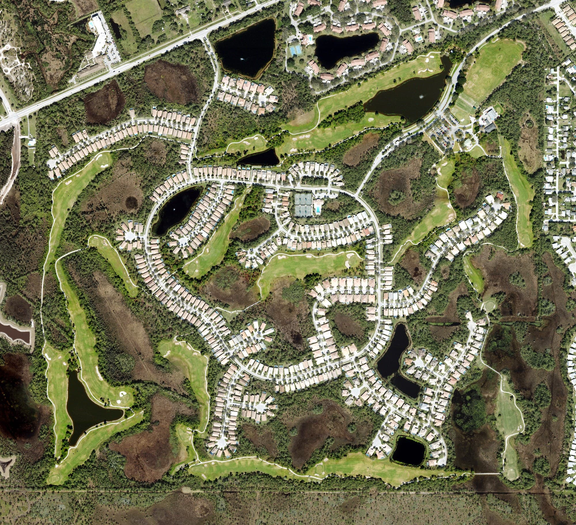 Aerial view of The Champions Club, FL, with its hole routing marked