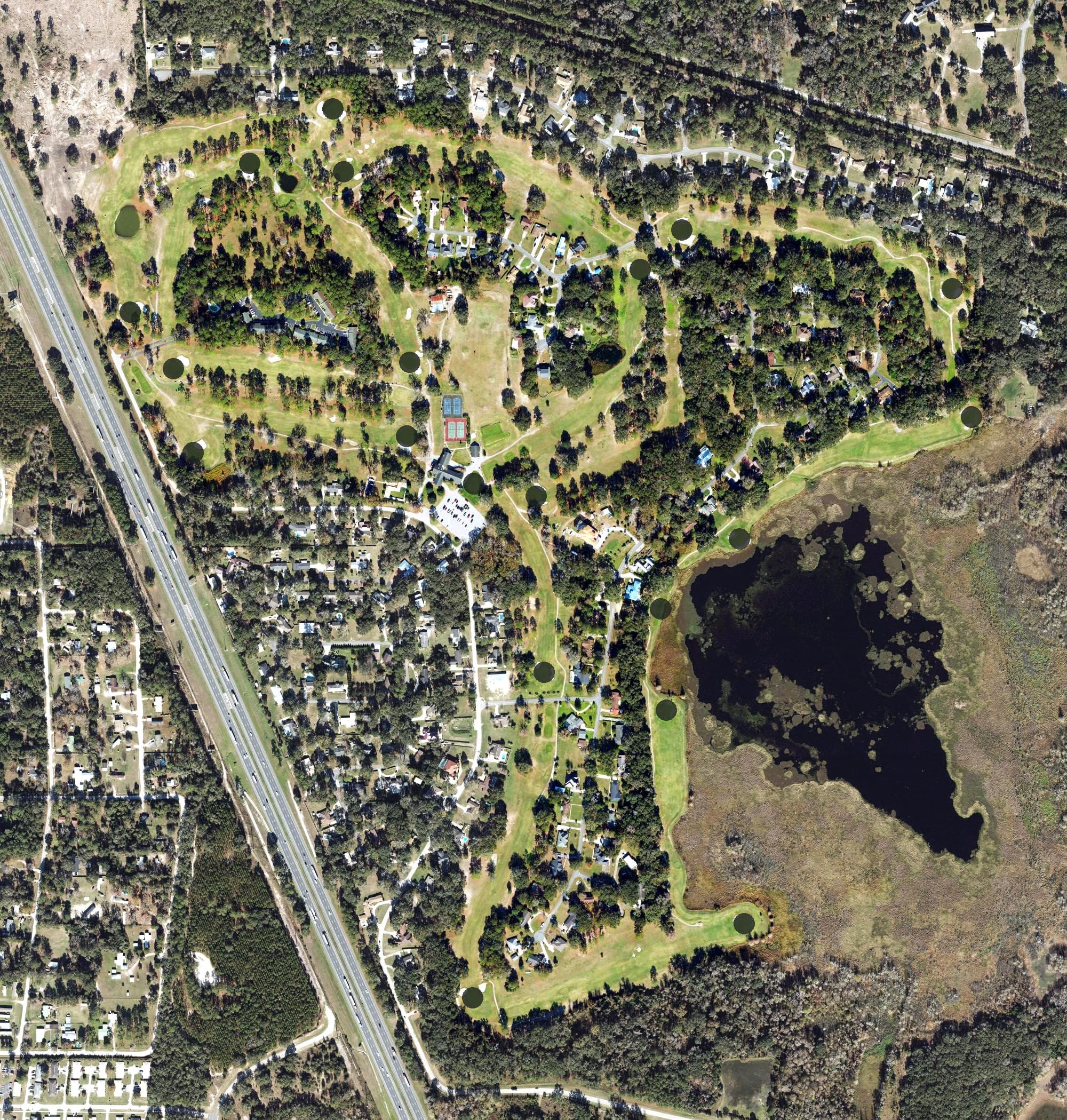 Aerial view of The Country Club at Lake City, FL, with its hole routing marked